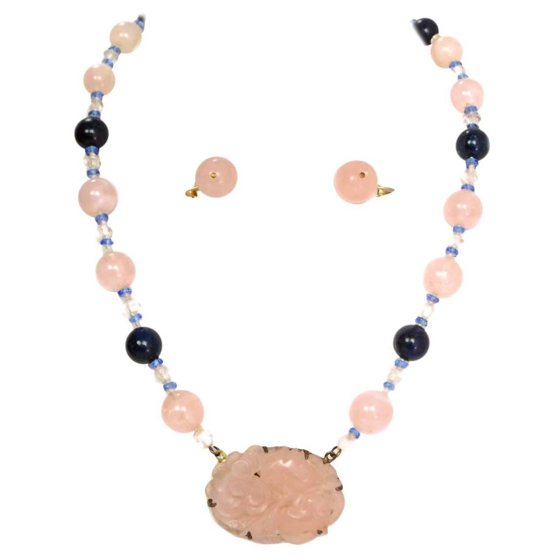 Pale Pink & Navy Glass Bead Necklace & Earrings Set
Necklace features pale pink floral stone pendant
Closure: Necklace- Antique push and lock clasp, Earrings- clip on
Color: Pale pink, navy, light blue and silvertone
Materials: Glass,