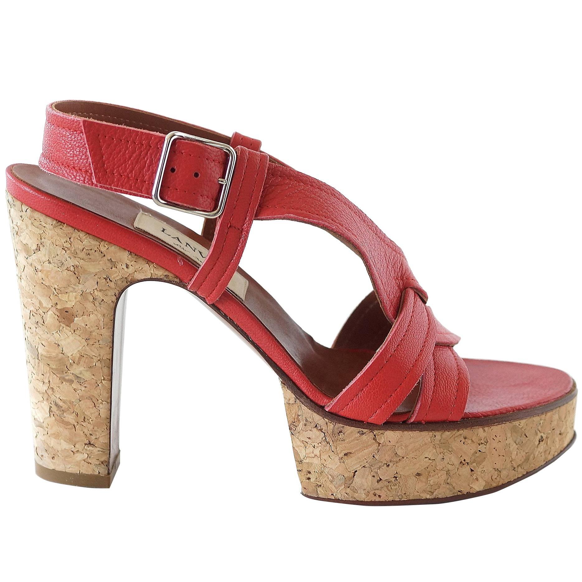 Guaranteed authentic Lanvin fabulous summer shoe!
Bold straps are in the softest and most delicious sumptuous Chevre (goat) leather. 
The front of the foot has a 'weave' effect of leather work.
Sleek and simple silver buckle.
Bold cork heel and