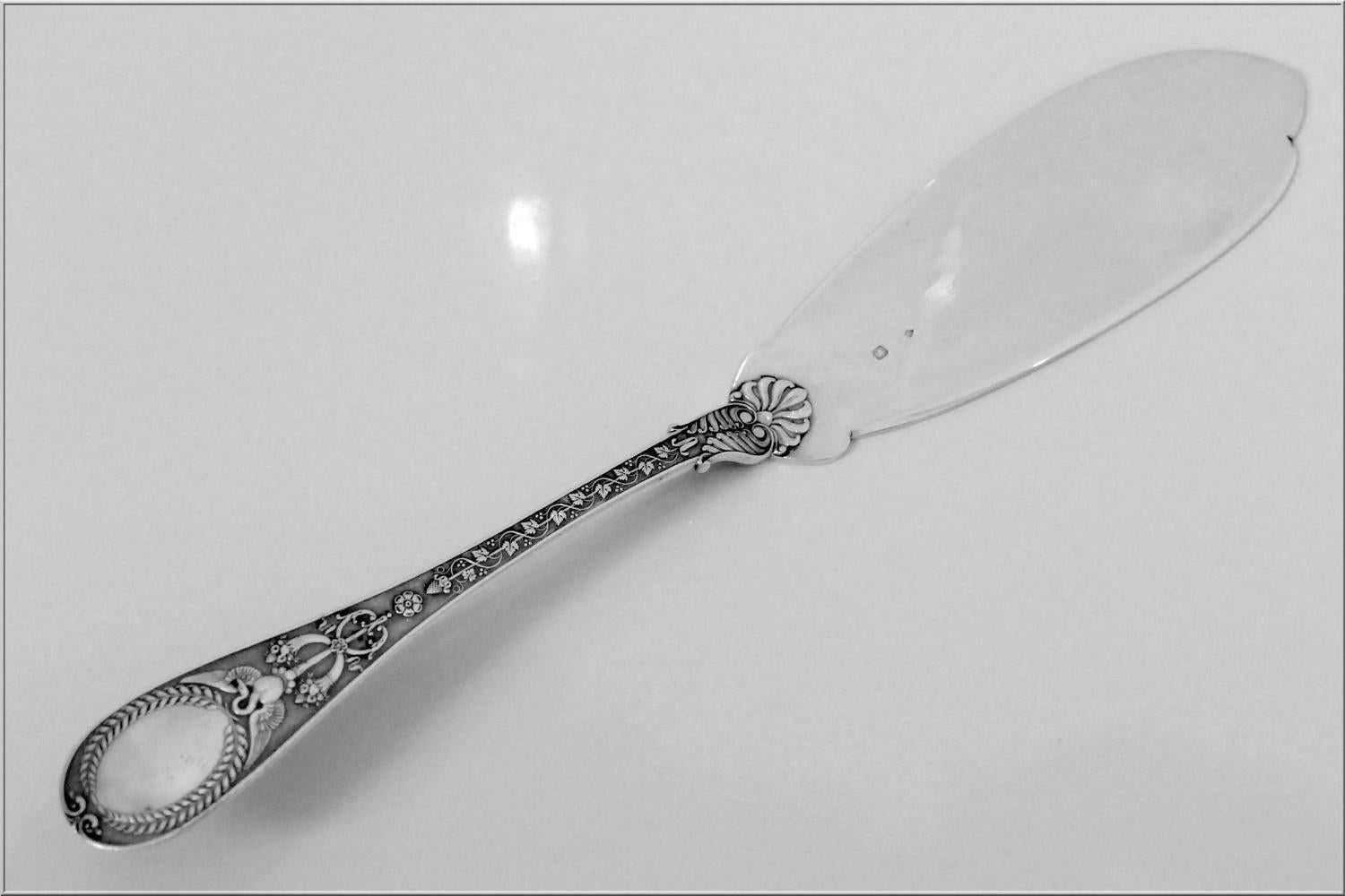 Head of Minerve 1 st titre for 950/1000 French sterling silver guarantee. 

Extremely rare Pie/Pastry/Fish Server of truly exceptional quality, for the richness of Empire pattern. Handle decorated on a stippled backround with grape-vines, flowers