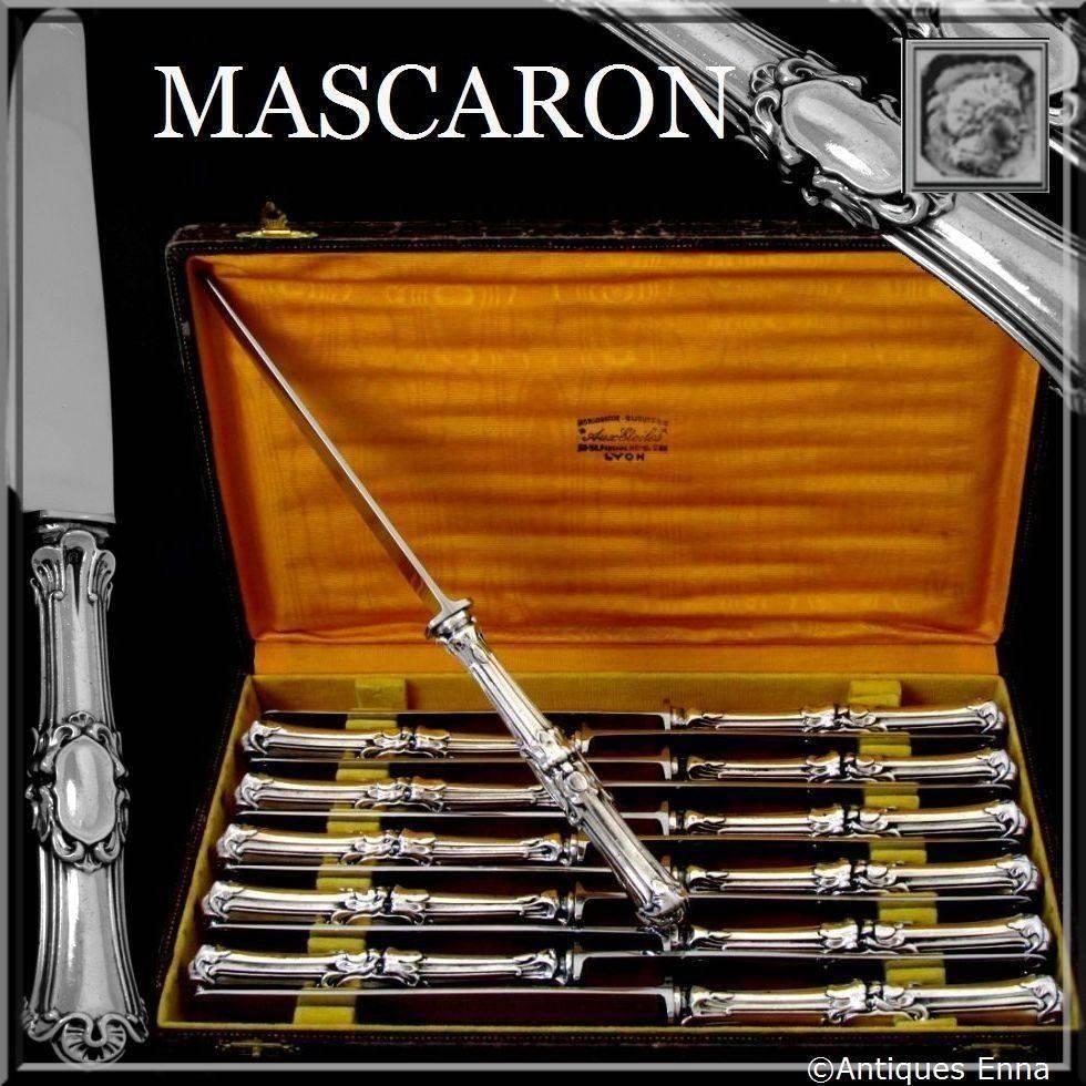 French sterling silver dinner knife set 12 piece Mascaron with box and stainless steel blades.

Head of Minerve 1st titre on the handles for 950/1000 French sterling silver guarantee and new stainless steel blades. 

12 pieces of truly