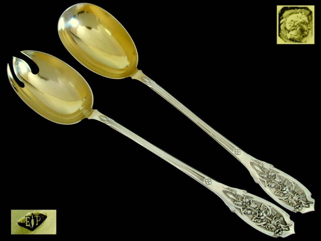 The design and workmanship of this set is exceptional.  This salad serving set comprising a three-tined fork and a spoon. the polylobed bowl of the fork and spoon are in sterling silver-gilt (vermeil inside). The handles have sophisticated and
