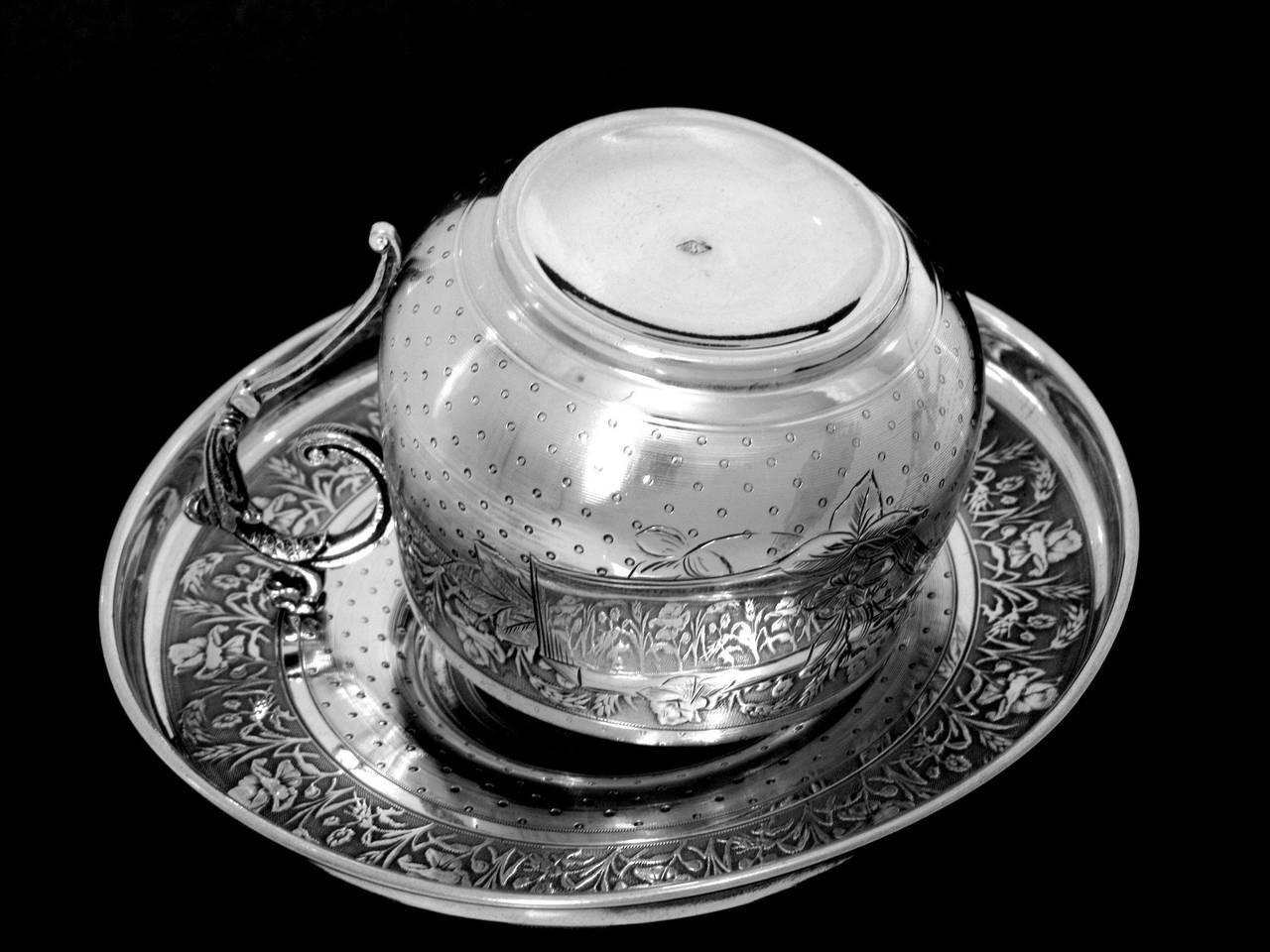 silver tea cups and saucers