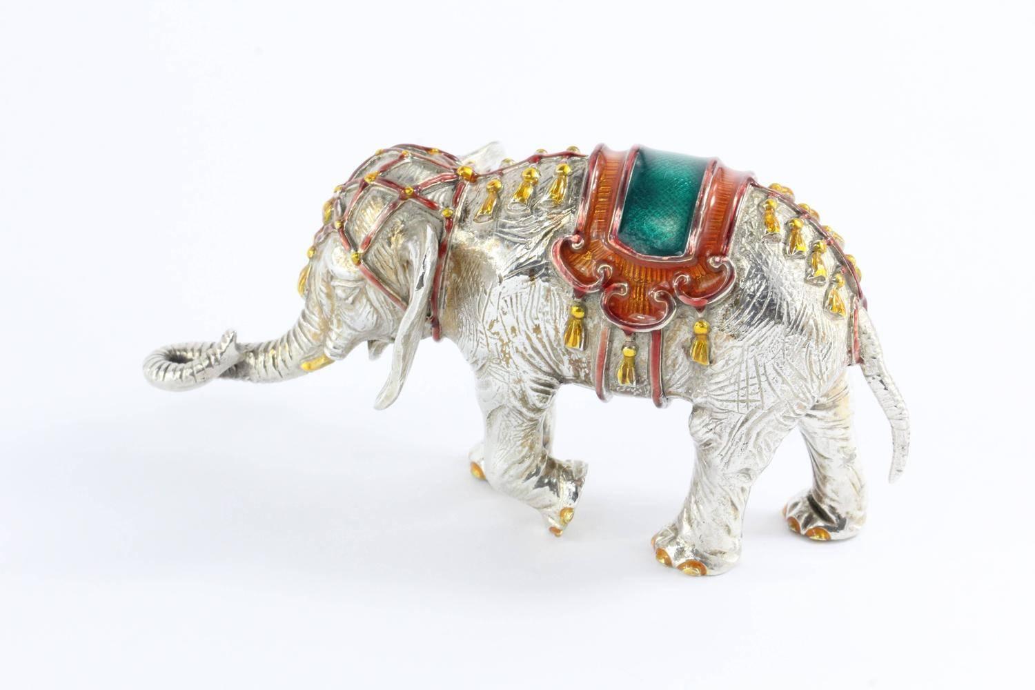 A beautifully enameled sterling silver circus figurine of a baby elephant; designed by Gene Moore for Tiffany & Co in New York. Marked “Tiffany & Co. 925 Sterling.” Approximate length: 4.375 inches and approximate height 2.31 inches. Weight of the