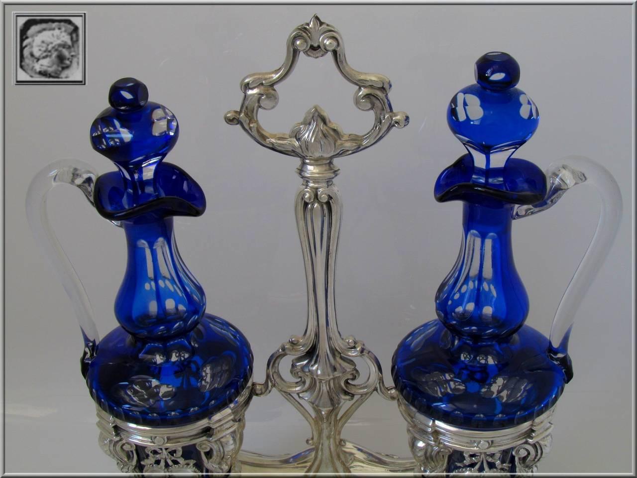 Imposing French sterling silver oil and vinegar cruet set, Baccarat cobalt blue, Louis XVI decoration.

Head of Minerve 1 st titre for 950/1000 French sterling silver guarantee.

Imposing measure:
12"2 (31 cm) height
10"1 x 6"1 (26 cm