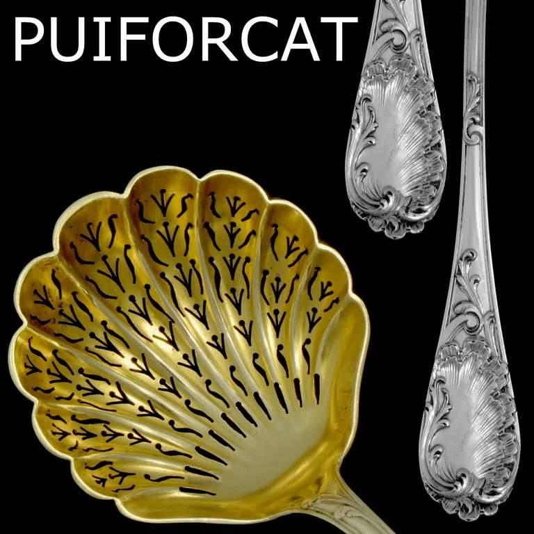 Puiforcat French sterling silver 18-karat gold sugar sifter spoon rococo.

A rare sugar sifter spoon of truly exceptional quality, for the richness of Rococo pattern. Vermeil bowl and handle is decorated with fantastic decoration in the Rococo