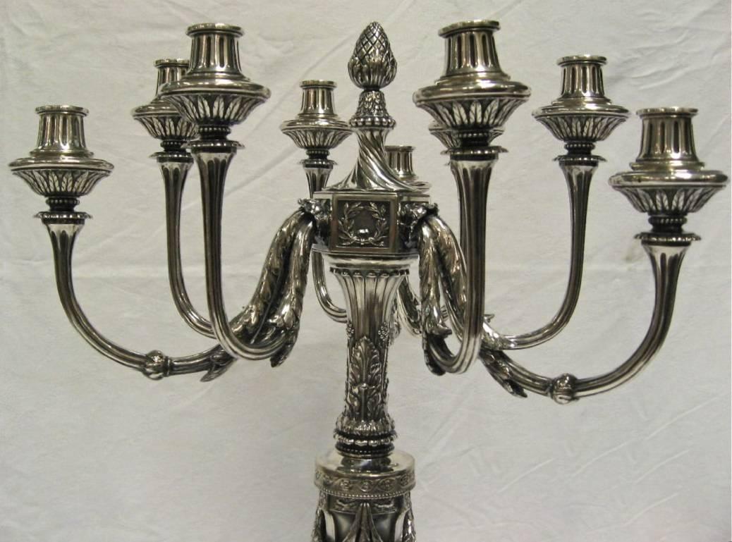 A magnificent and very impressive pair of large and decorative silver candelabra. Standing 31.5