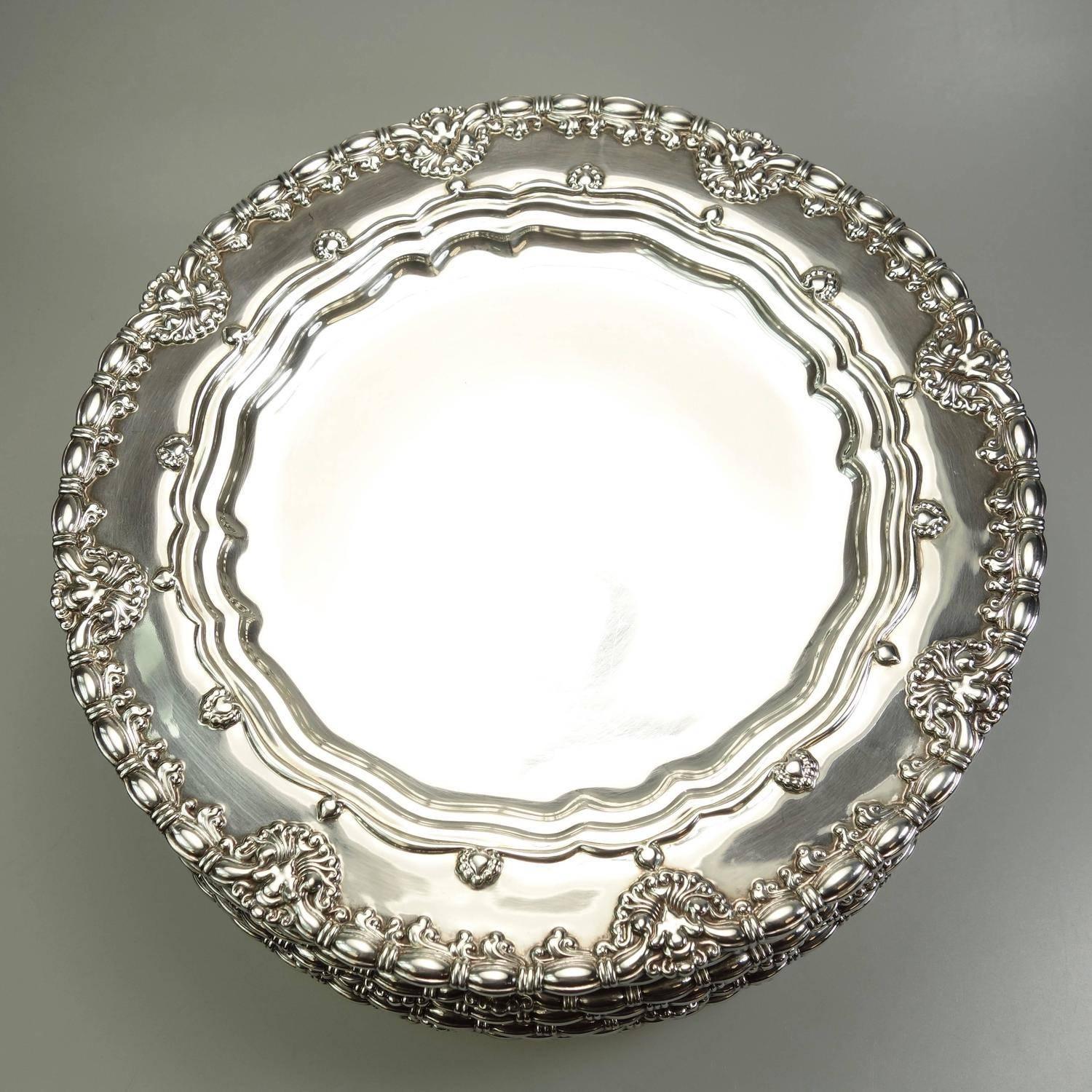 This magnificent set of Tiffany & Co. Sterling Silver plates has the same pattern as a set made for J.P.Morgan in 1895. The Morgan set is documented in Charles H. Carpenter, Jr.'s book, Tiffany Silver.   The plates are each fully hallmarked with: