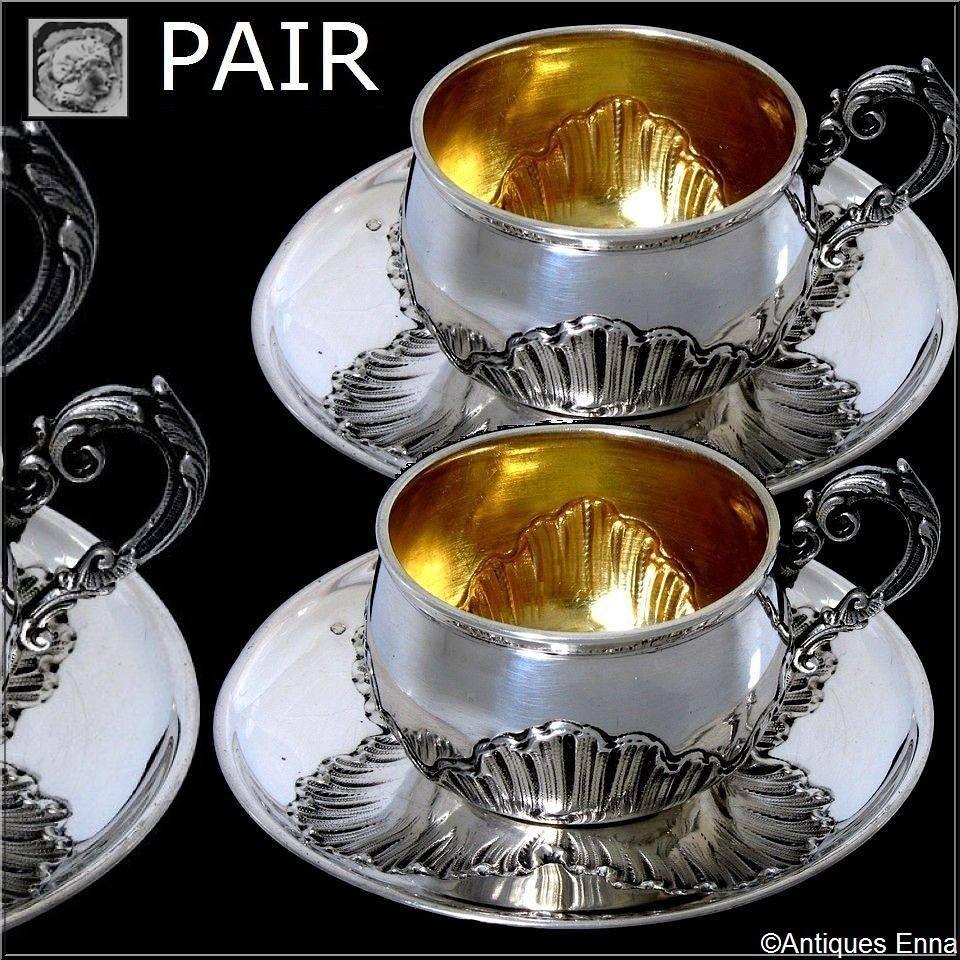 Pair of French sterling silver vermeil coffee/tea cups with saucers Rococo pattern.

Head of Minerve 1 st titre for 950/1000 French sterling silver vermeil guarantee.

Exceptional and rare pair of French sterling silver tea or coffee, including two