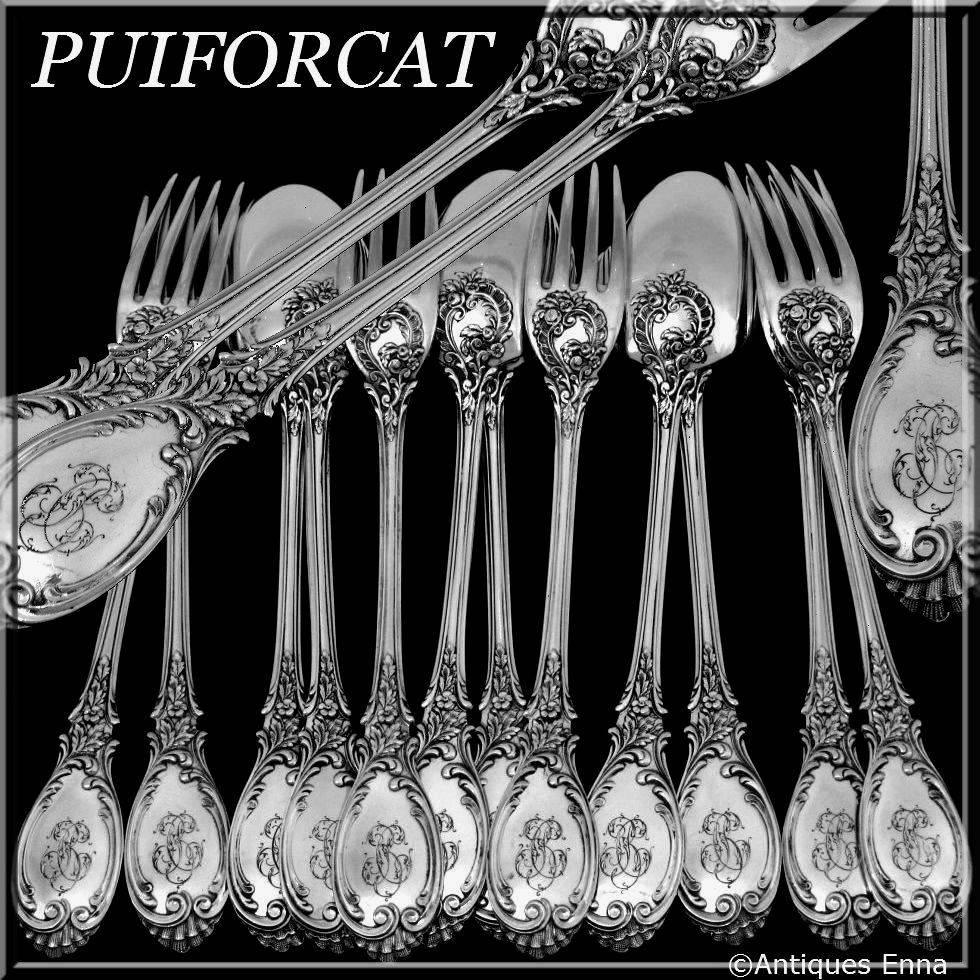 Puiforcat French sterling silver dessert entremet flatware set of 12 pieces Roses.

Handles have Rococo decoration with a sophisticated foliage decoration. This model is called 