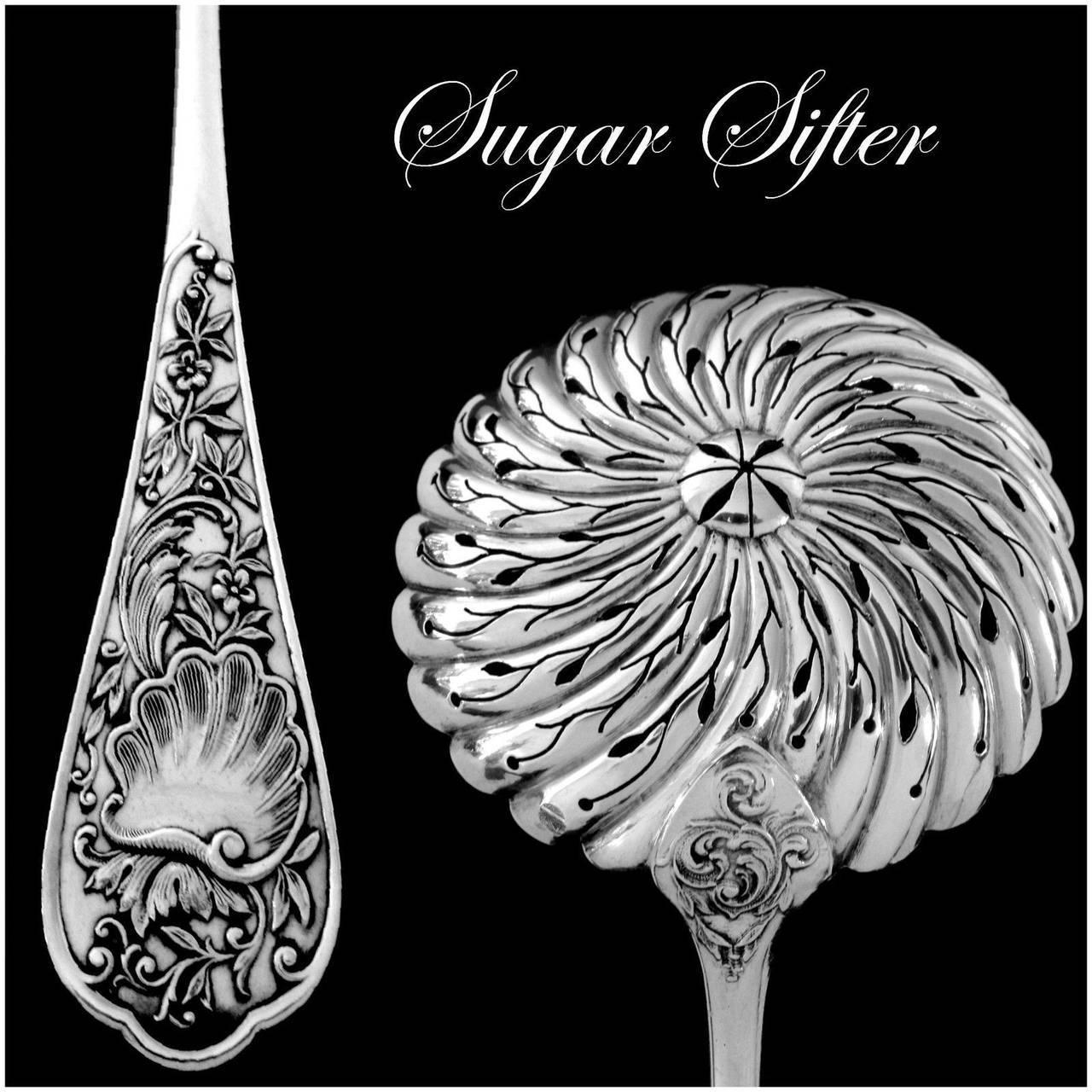 Boulenger fabulous French all sterling silver sugar sifter spoon Rococo.

Head of minerve 1st titre for 950/1000 French sterling silver guarantee.

A rare sugar sifter spoon of truly exceptional quality, for the richness of Rococo pattern. No