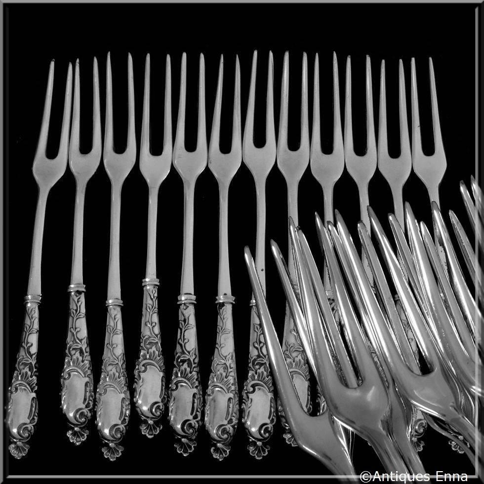 Gabert French sterling silver shellfish snails forks set of 12 pieces Rococo.

Boar's head on the handles for guarantee 800/1000 French sterling silver. The upper parts are silver plated. No monograms.

Silversmith:
Henri Gabert.
112 rue de Turenne,