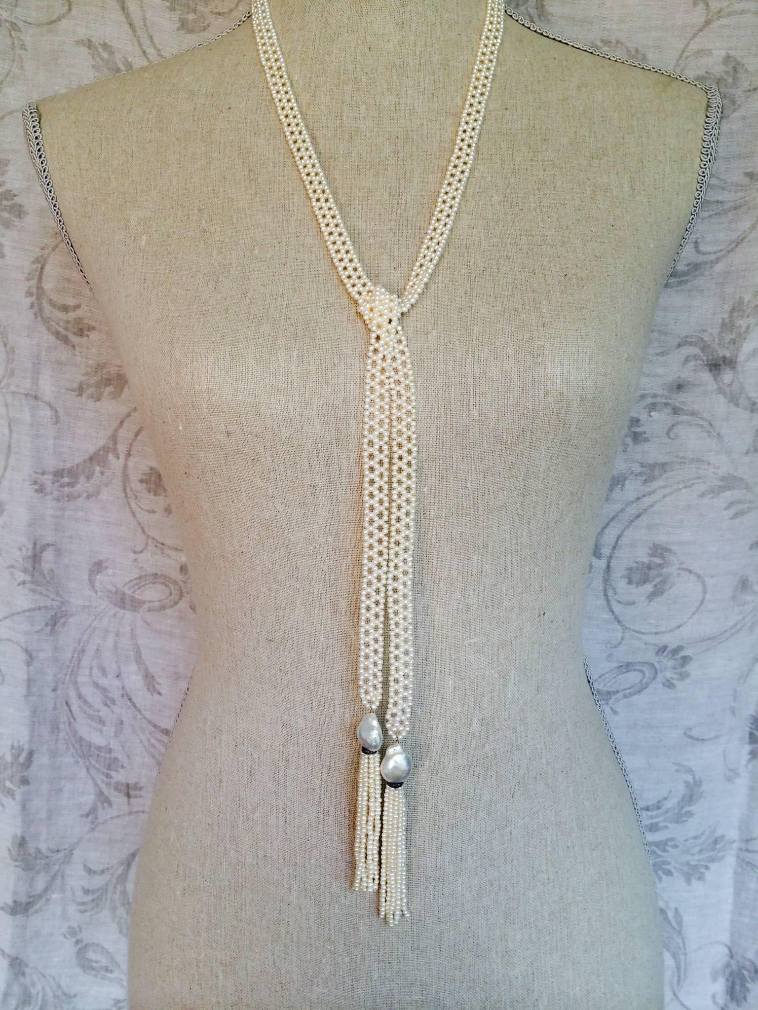 Marina J presents a unique handmade sautoir made of small  white pearls. This sautoir  is hand woven with 2 mm seed pearls into a delicate lace-like design. The ends of the necklace taper to large white pearls and diamond and silver rondels , from