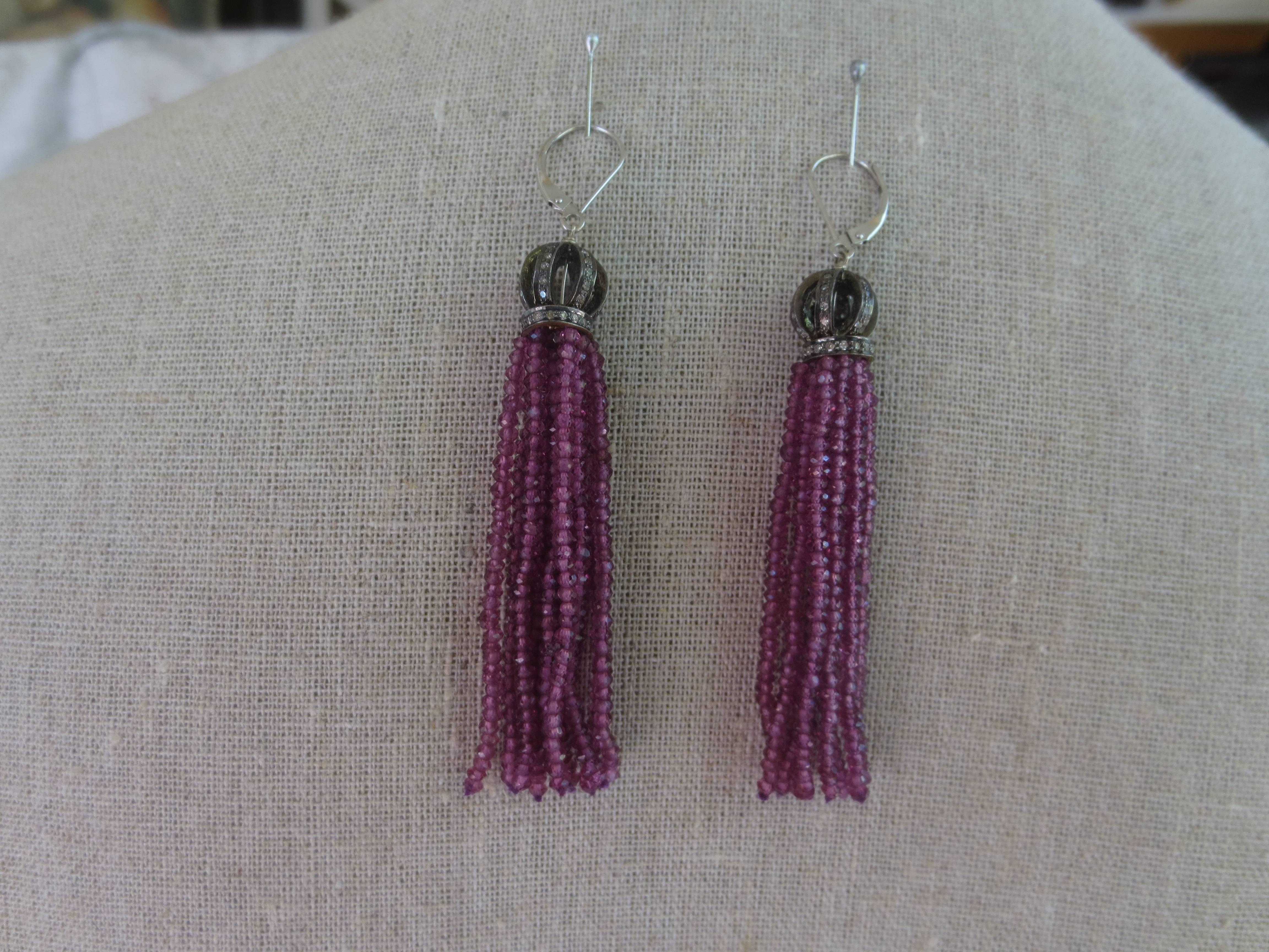 Lovely garnet tassel earrings by Marina J. The tassels are 3 inches long, and emanate from a lovely diamond and silver 