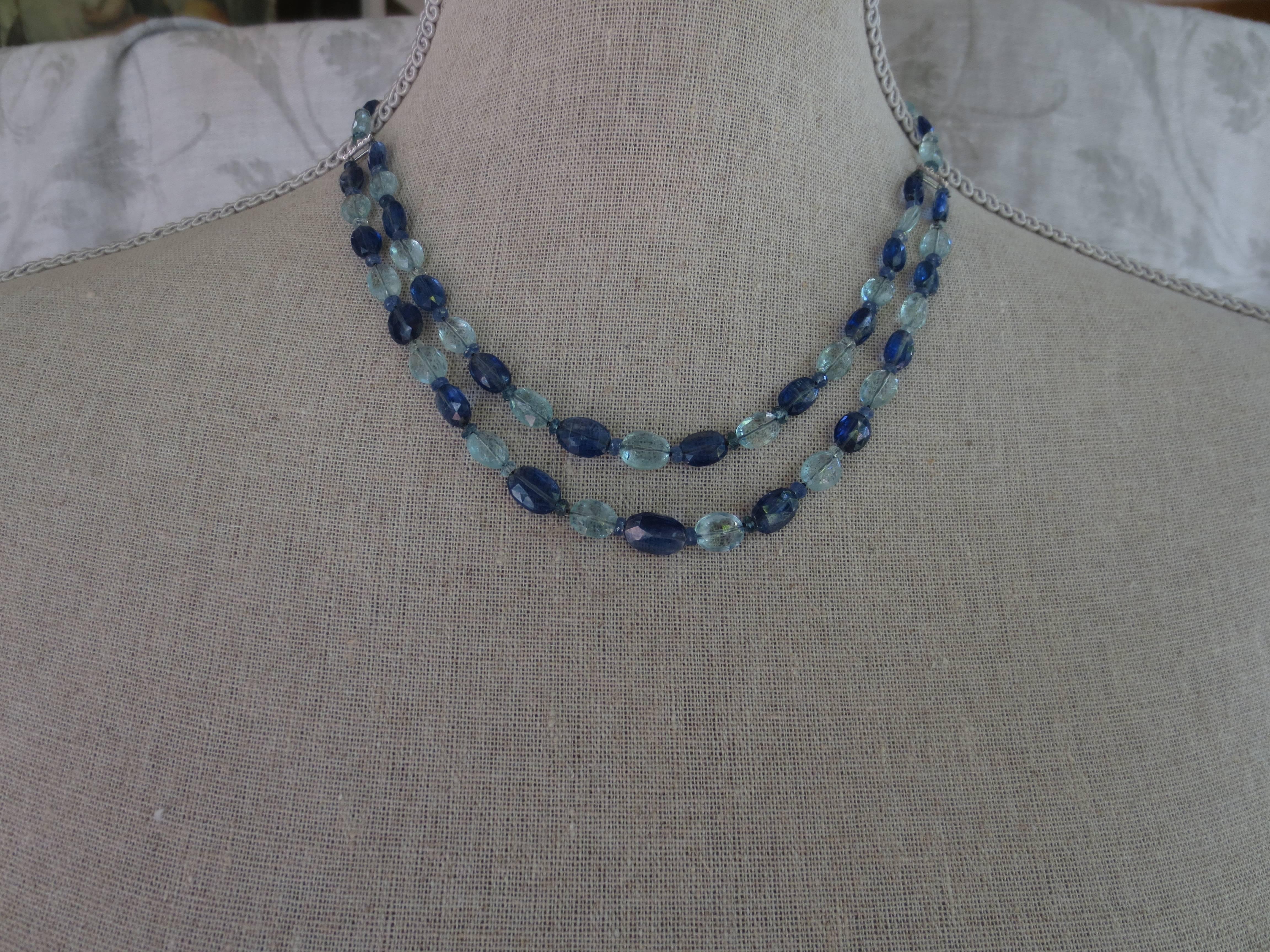 A sophisticated two-strand beaded necklace by Marina J of blue topaz and kyanite. One strand nestles atop the other. This necklace has a 14 karat white gold clasp and a gold and diamond bar and is 17 1/2 inches long. A very versatile look.