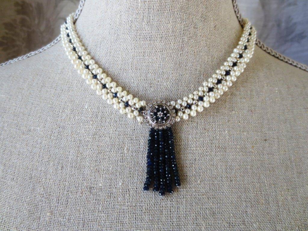 Graceful necklace by Marina J. The cultured white pearls range in size from 3 to 3.5 mm and are arranged in two double rows of pearls with sapphire and white gold beads interspersed between them. 

The centerpiece of this lovely necklace is