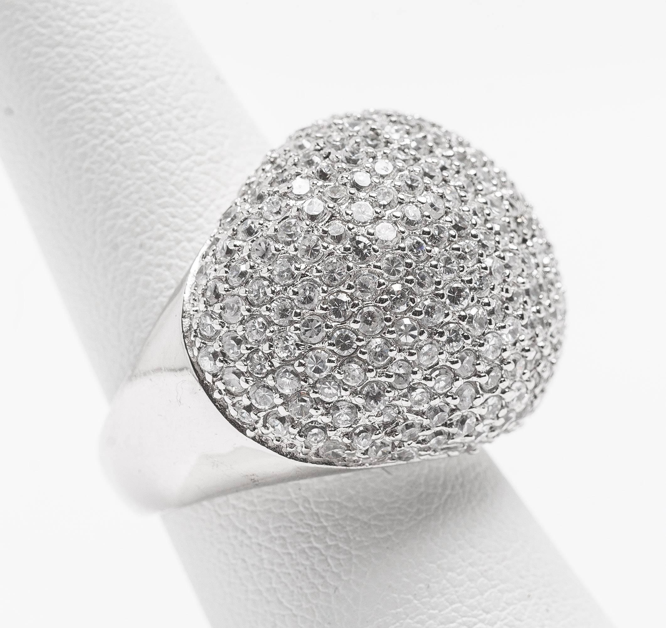 Pave faux diamond cocktail ring made with micro set cubic zircons set in rhodium sterling. The top measures about 1'' around. Simple and elegant.