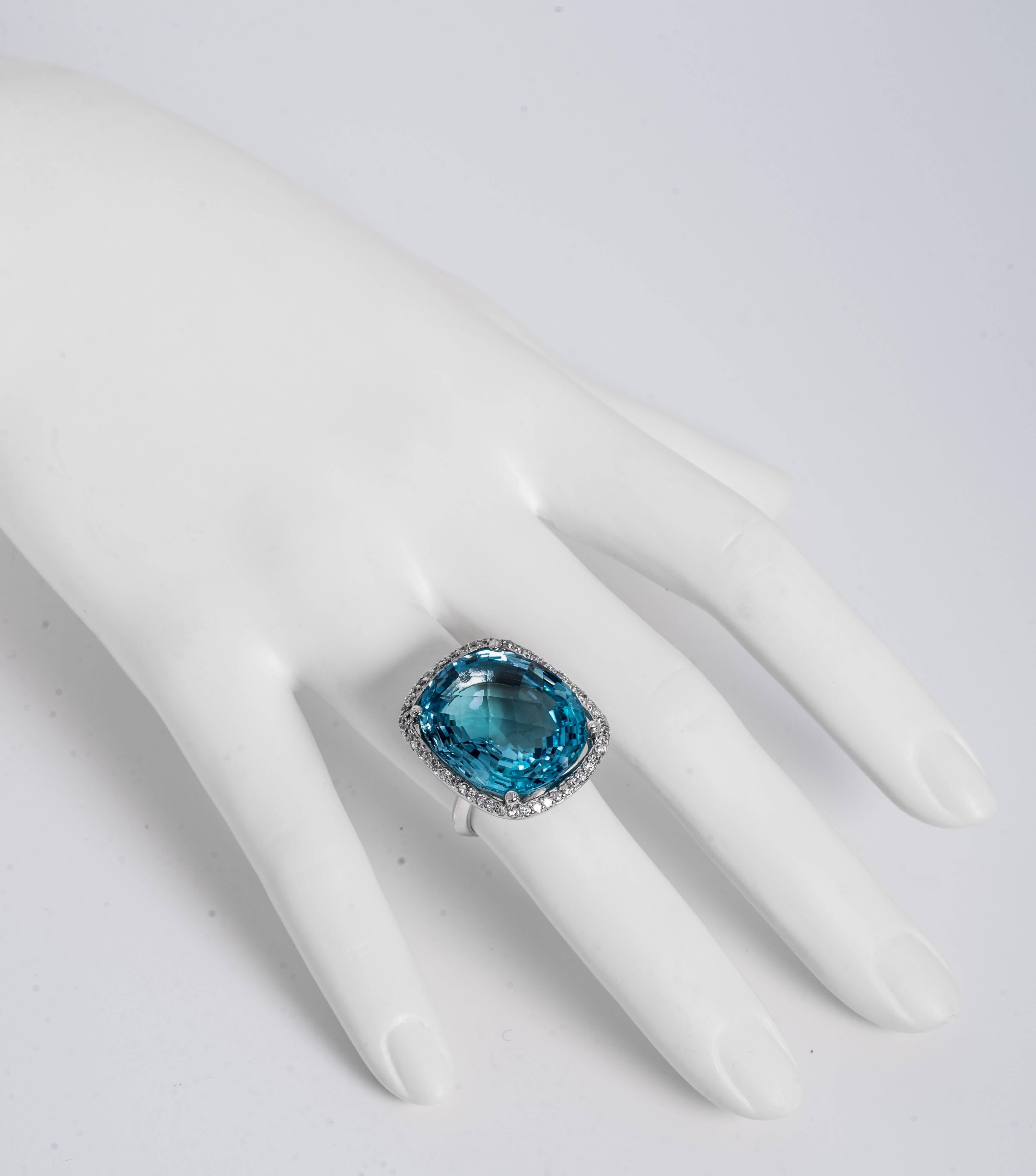 Wonderful Swiss blue faceted topaz faux diamond cocktail ring set in sterling. Can sized complimentary. Measures 1inch length and 3/4inch across