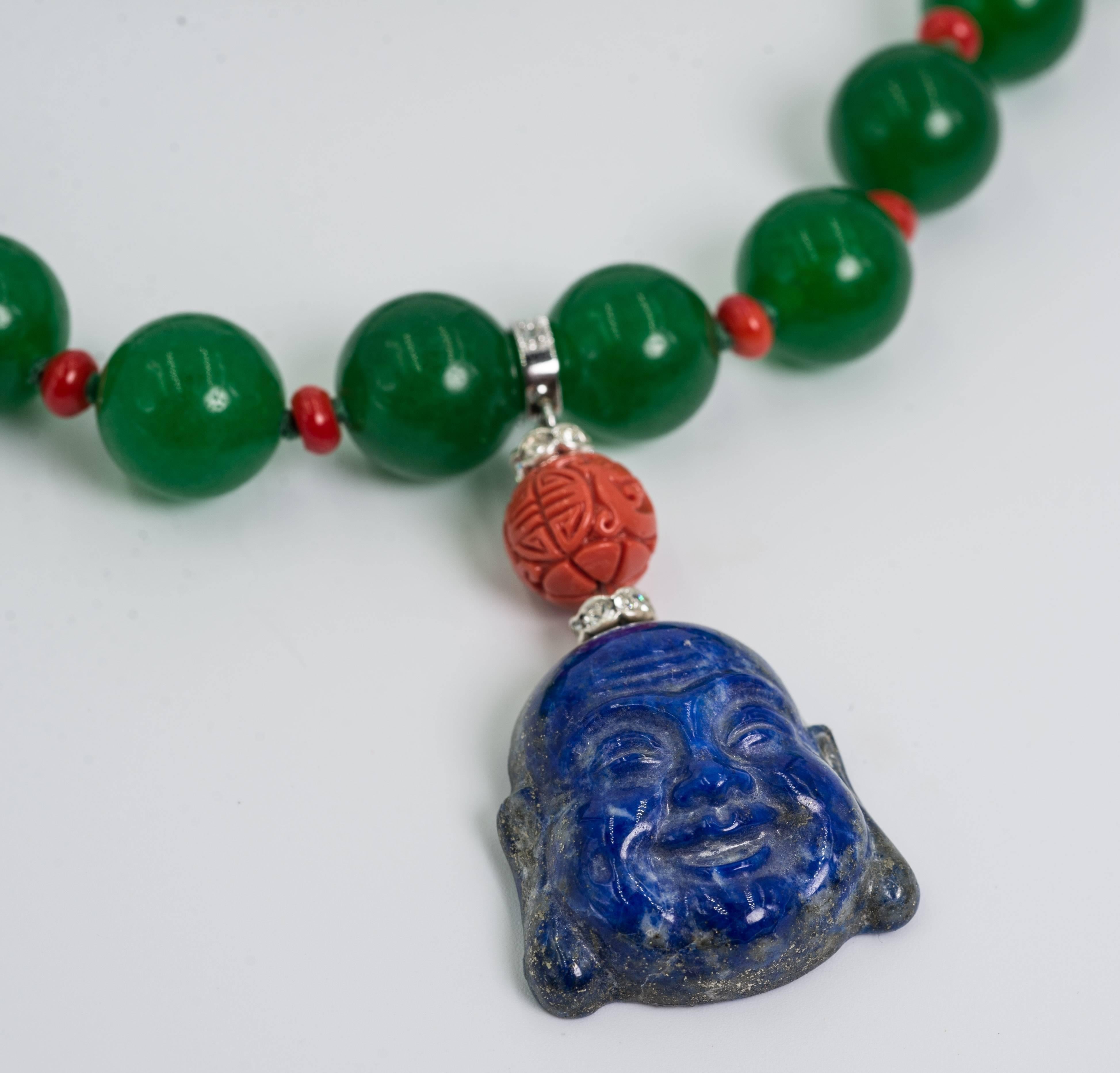 Fabulous faux Imperial jade bead coral real lapis lazuli Happy Buddha necklace
one-of-a-kind beautifully made with chic and style.
The necklace fits an 18''neck and the Buddha pendant is 2'' long. Traditional pave ball clasp.