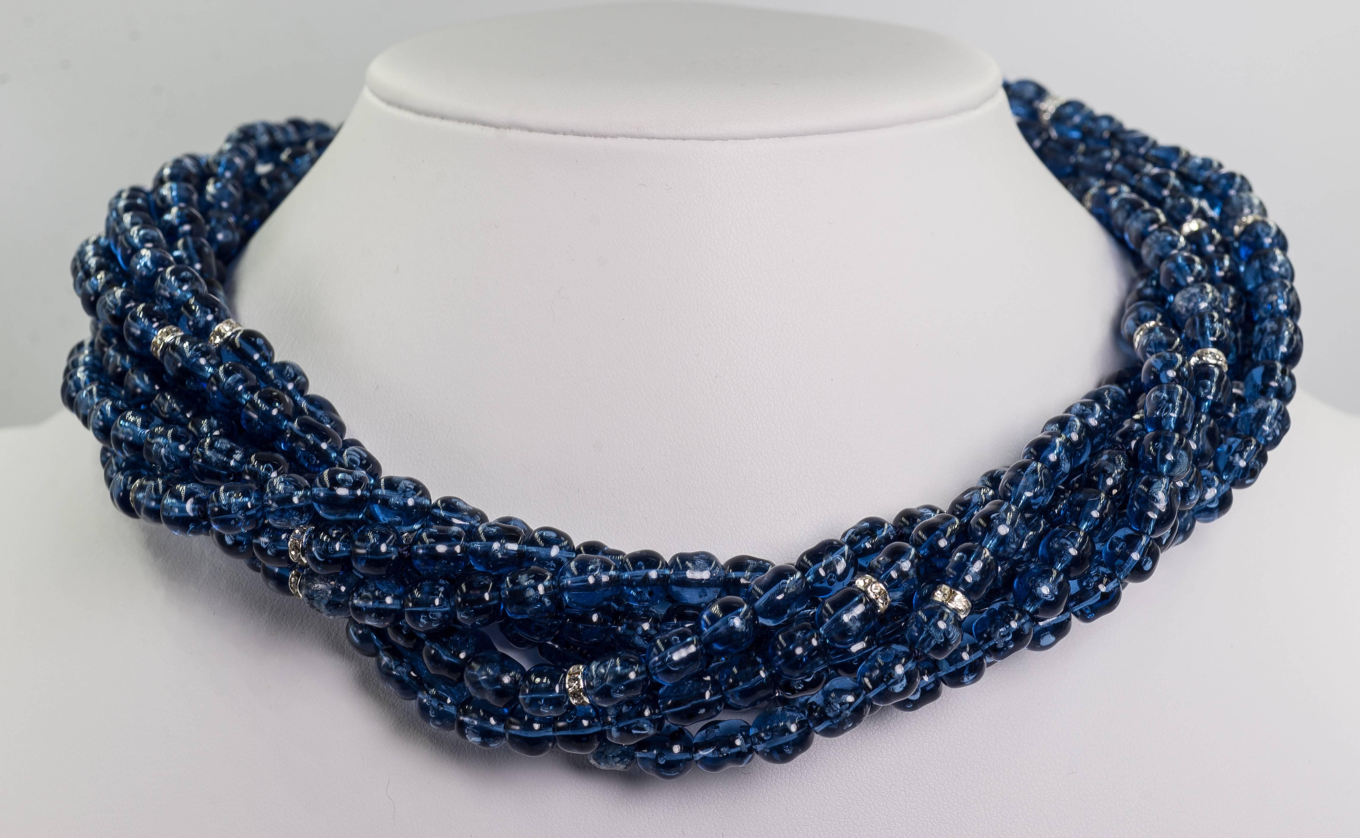 Vintage Bergdorf Chic Faux Sapphire crystal rondel  bead twist collar necklace attached to an amazing unique zircon set sterling clasp that alone measures 4 inches long.
The necklace measure 18'' fully twisted but can be worn longer. It's thickness
