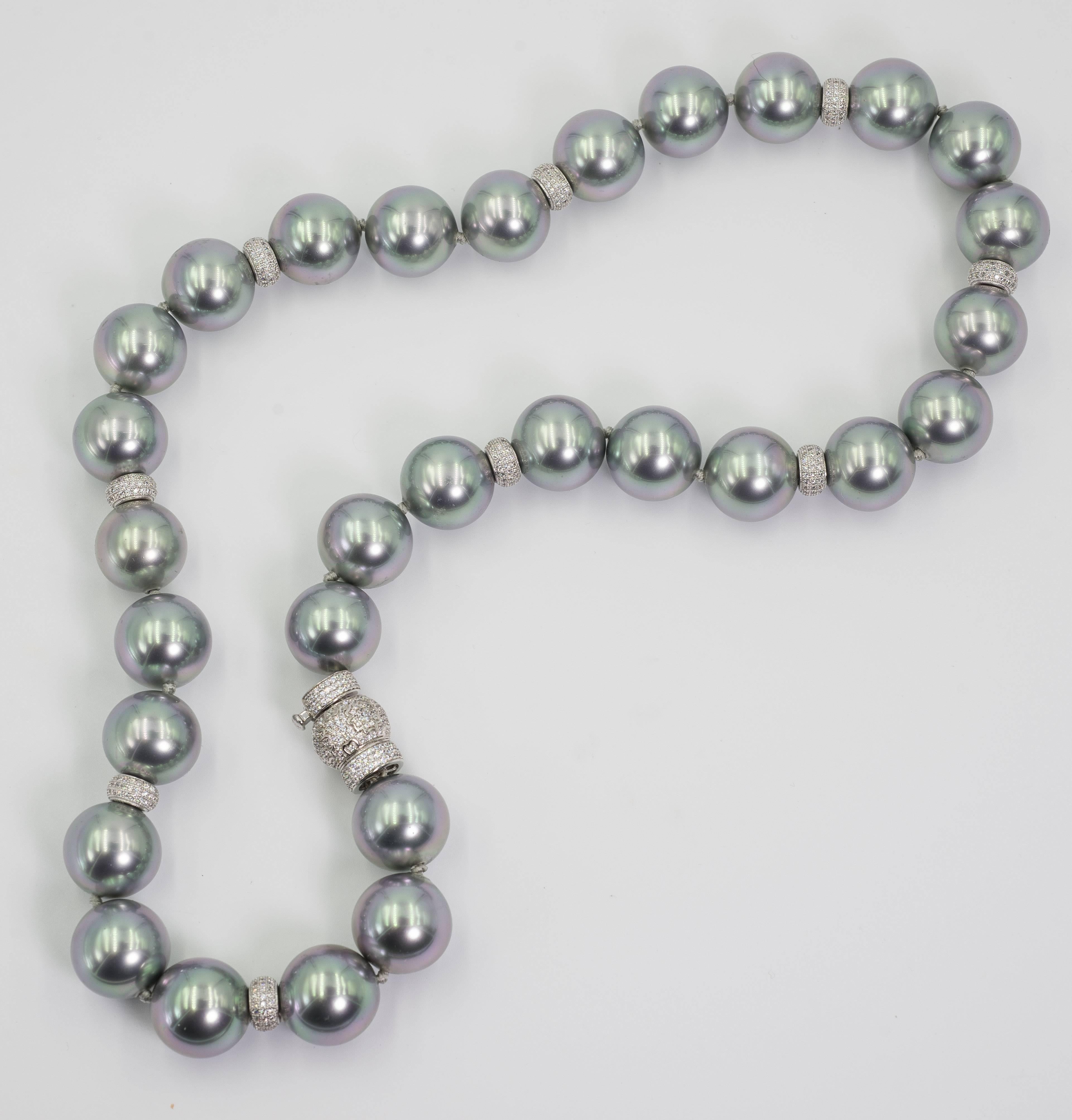 24 inch faux 18mm French Gris Argent handmade pearls by France's oldest faux pearl makers dating back to Napoleon lll.  The unique color 18mm pearls were made exclusively for Bergdorf Goodman over 20 years ago. The pearls are interspaced with pave