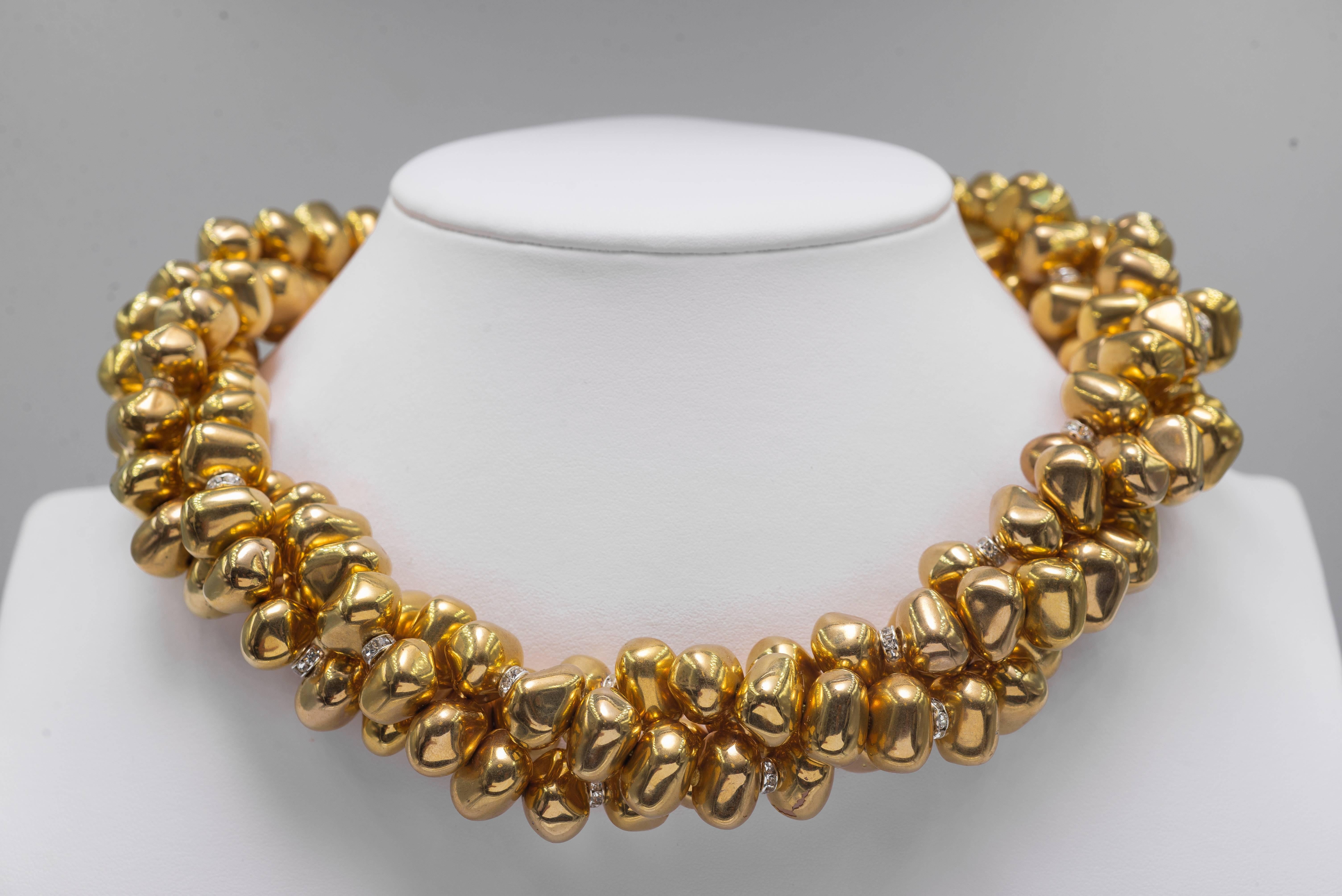 Vintage gilt nugget 15mm beads crystal rondel triple strand twist collar necklace attached to an amazing unique zircon set sterling clasp that alone measures 4 inches long.
Fits an easy 18''+ neckline