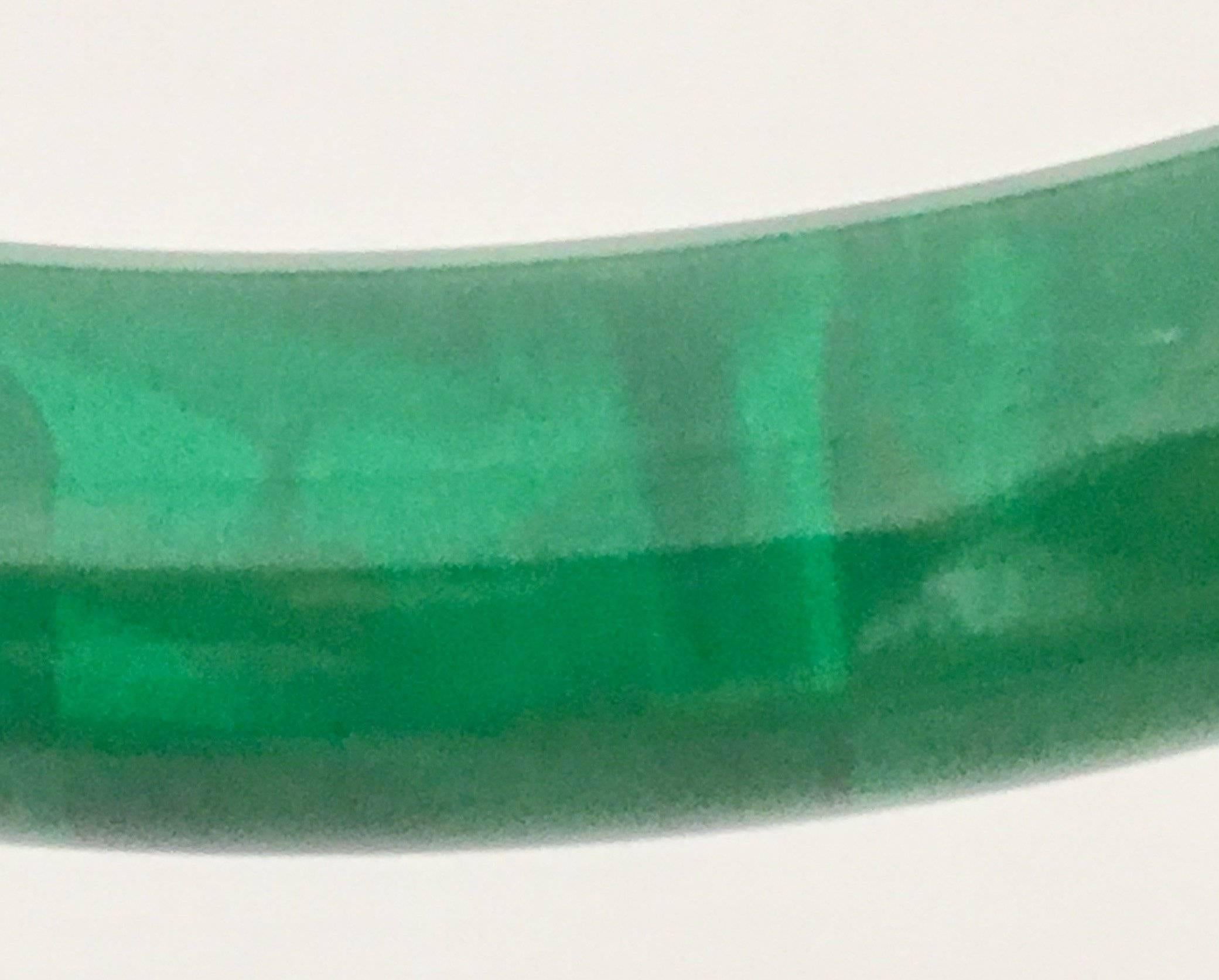 Mid-Century rare emerald green translucent bakelite bangle bracelet. Interior diameter measures, 2.65