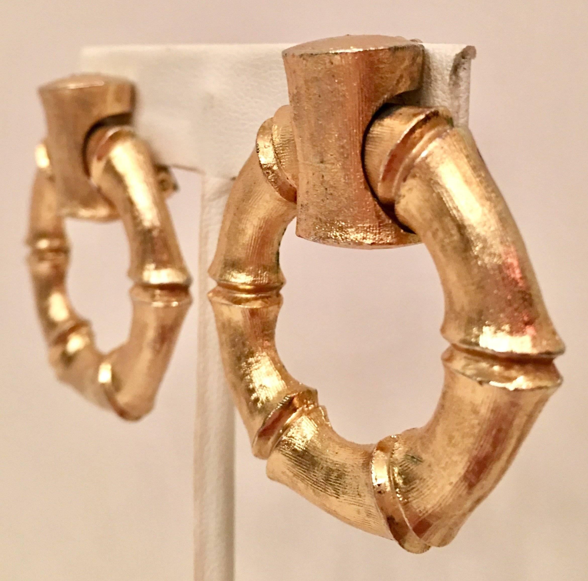 Vintage Napier brushed gold vermeil faux bamboo clip style hoop earrings. Signed on the underside, Napier.
