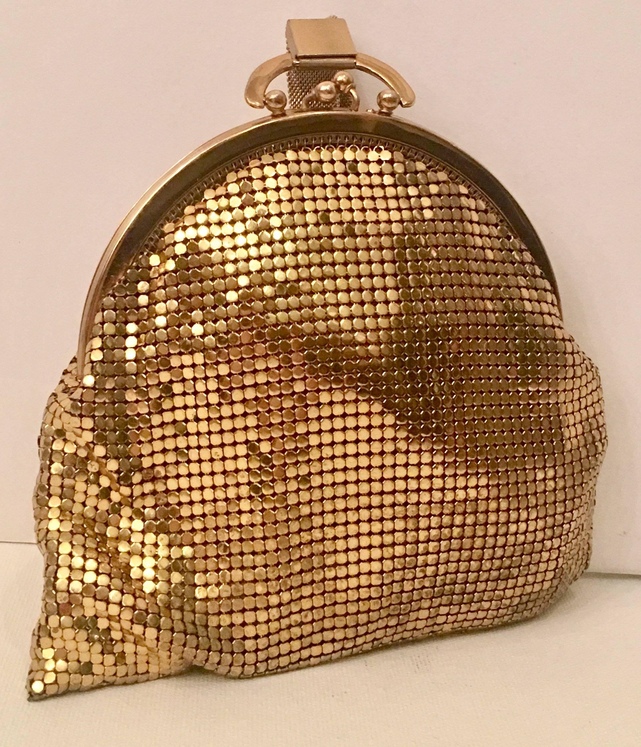 Whiting & Davis wristlet style gold metal mesh handbag. The interior Whiting & Davis manufacturing tag is intact.