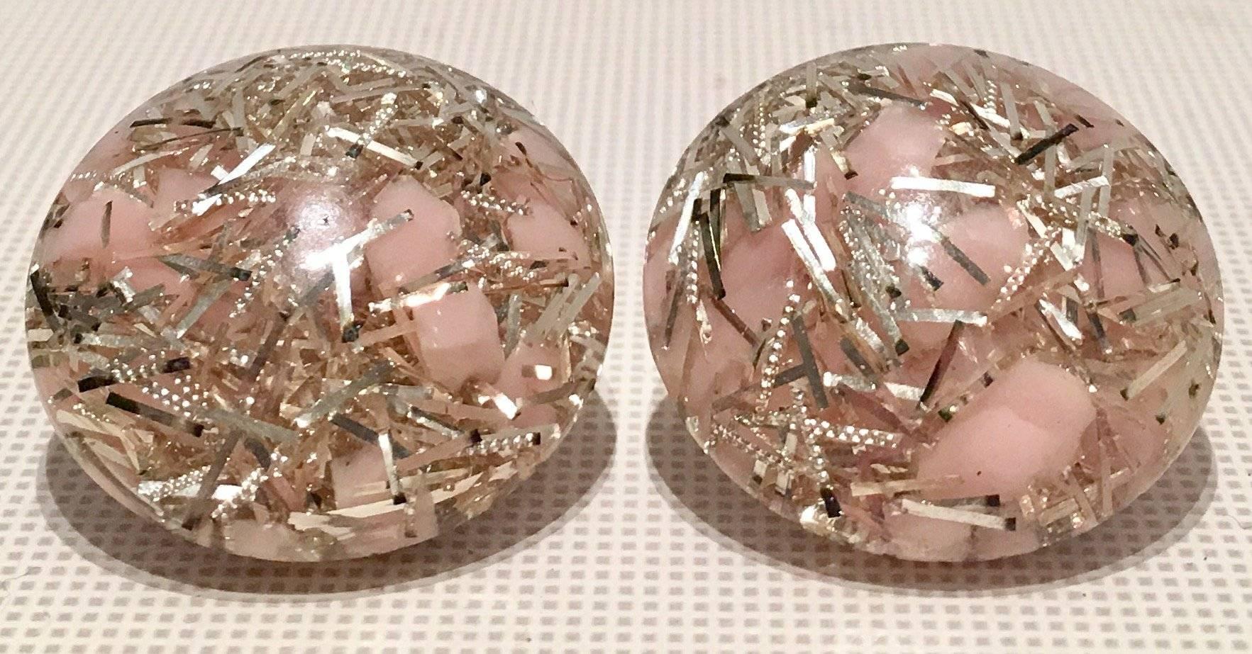 Mid-Century Lucite pink and silver metallic confetti "button" clip style earrings.
