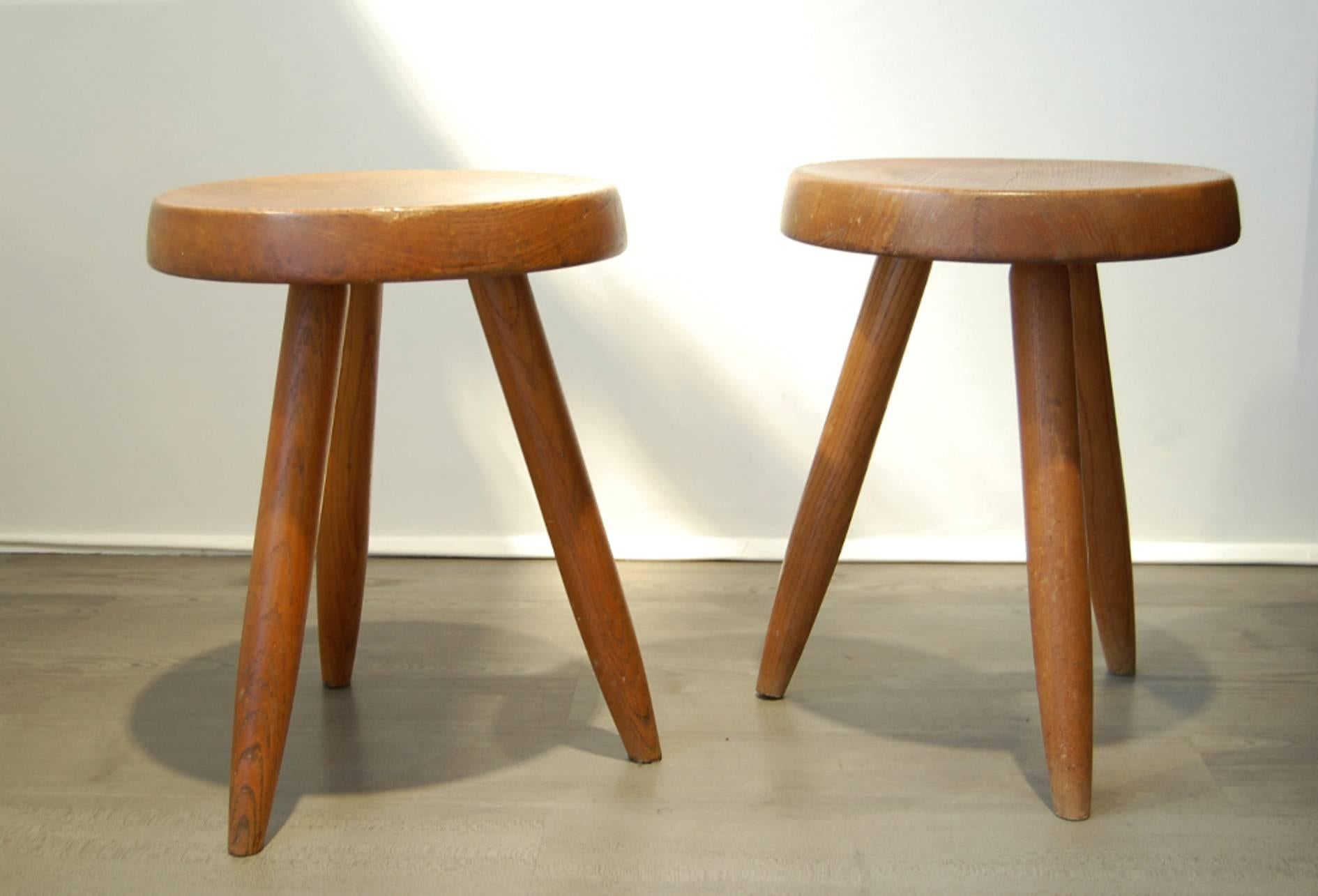 Pair of mahogany, tripod stools. Circular base on tapered legs,
circa 1960.