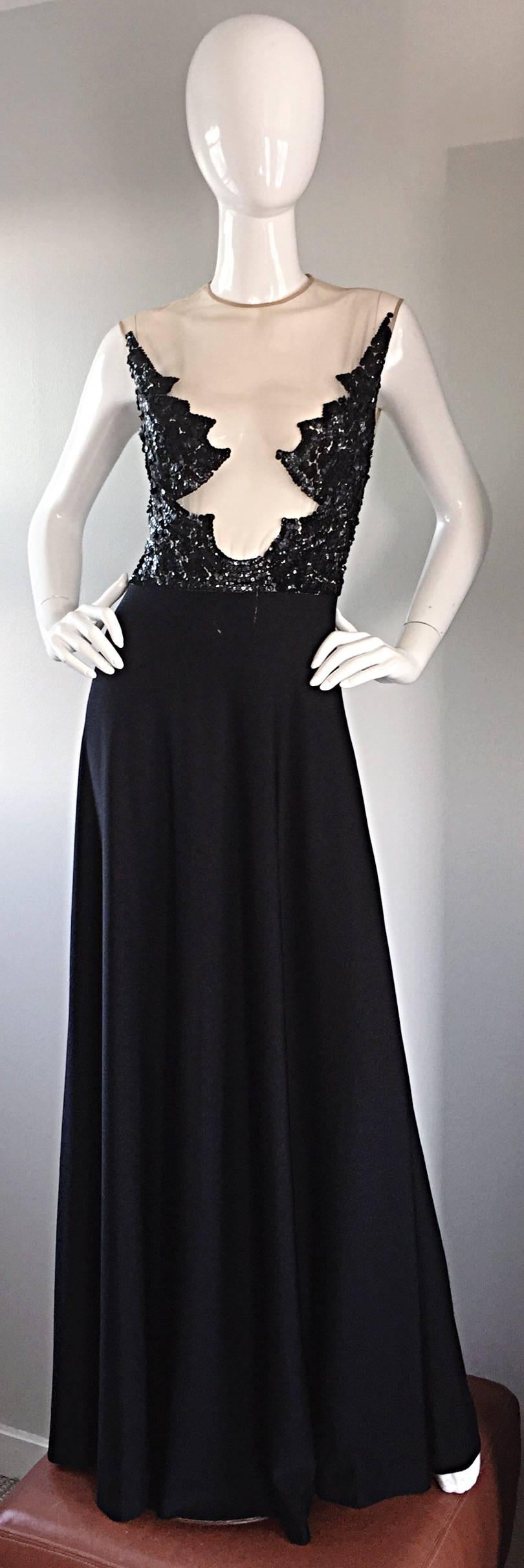 Absolutely incredible RARE 70s MR. BLACKWELL black vintage full length dress! Nude Illusion bodice, with strategically hand-sewn sequins, to cover just the right amount. Full black jersey skirt, with nude silk mesh on bodice, hand encrusted with