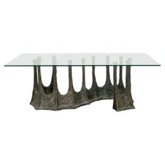 Guarda Dining Table with Organic S-Shaped Bronze Base and Glass Top