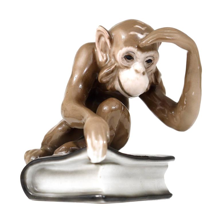 Monkey Sitting on a Darwin Book Figurine by Haas and Czjzek, Bohemia,  1940s at 1stDibs
