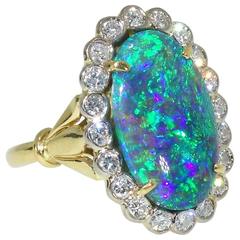 18K diamond and fine black opal ring