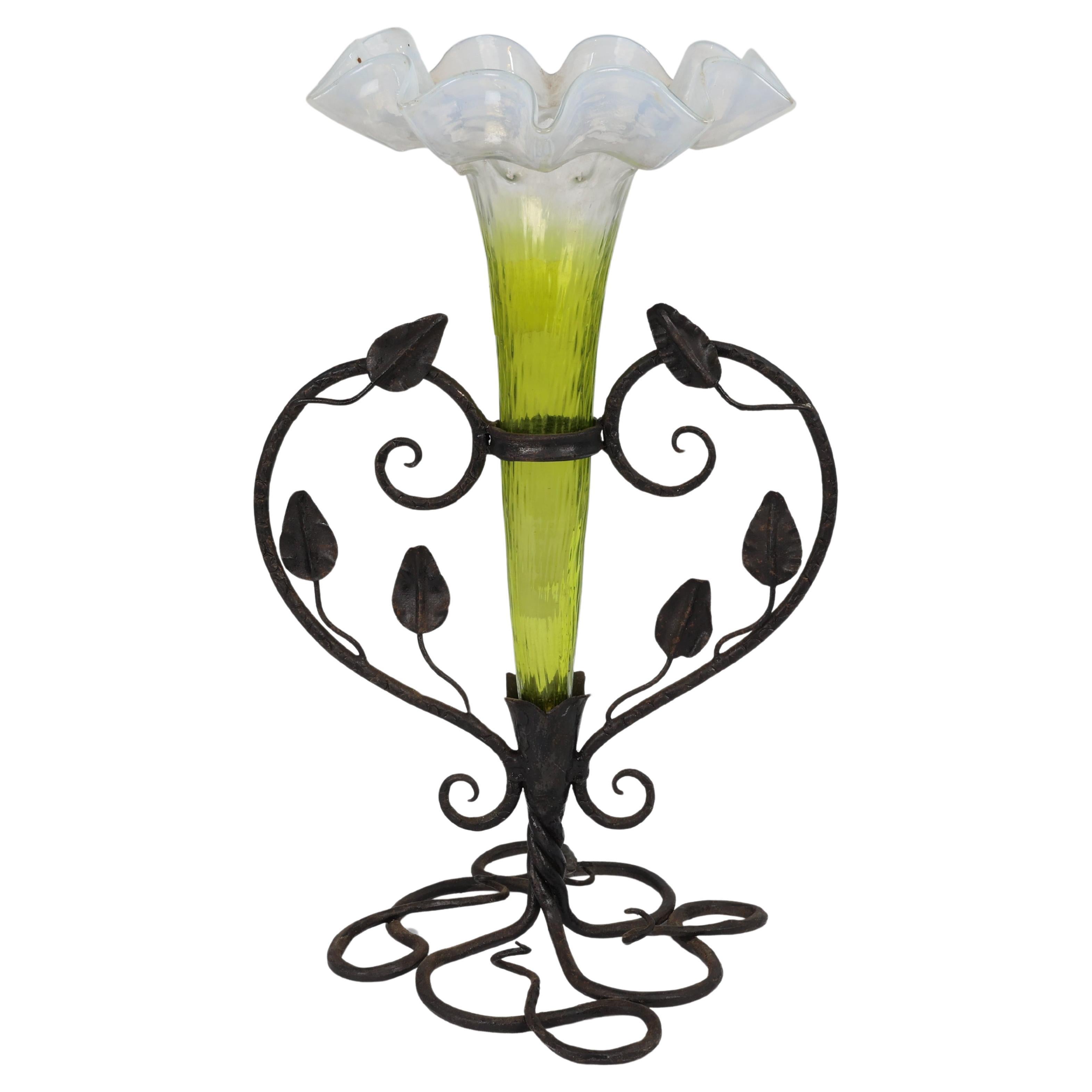 Art Nouveau French hand made iron epergne with a green & Vaseline glass flower. For Sale