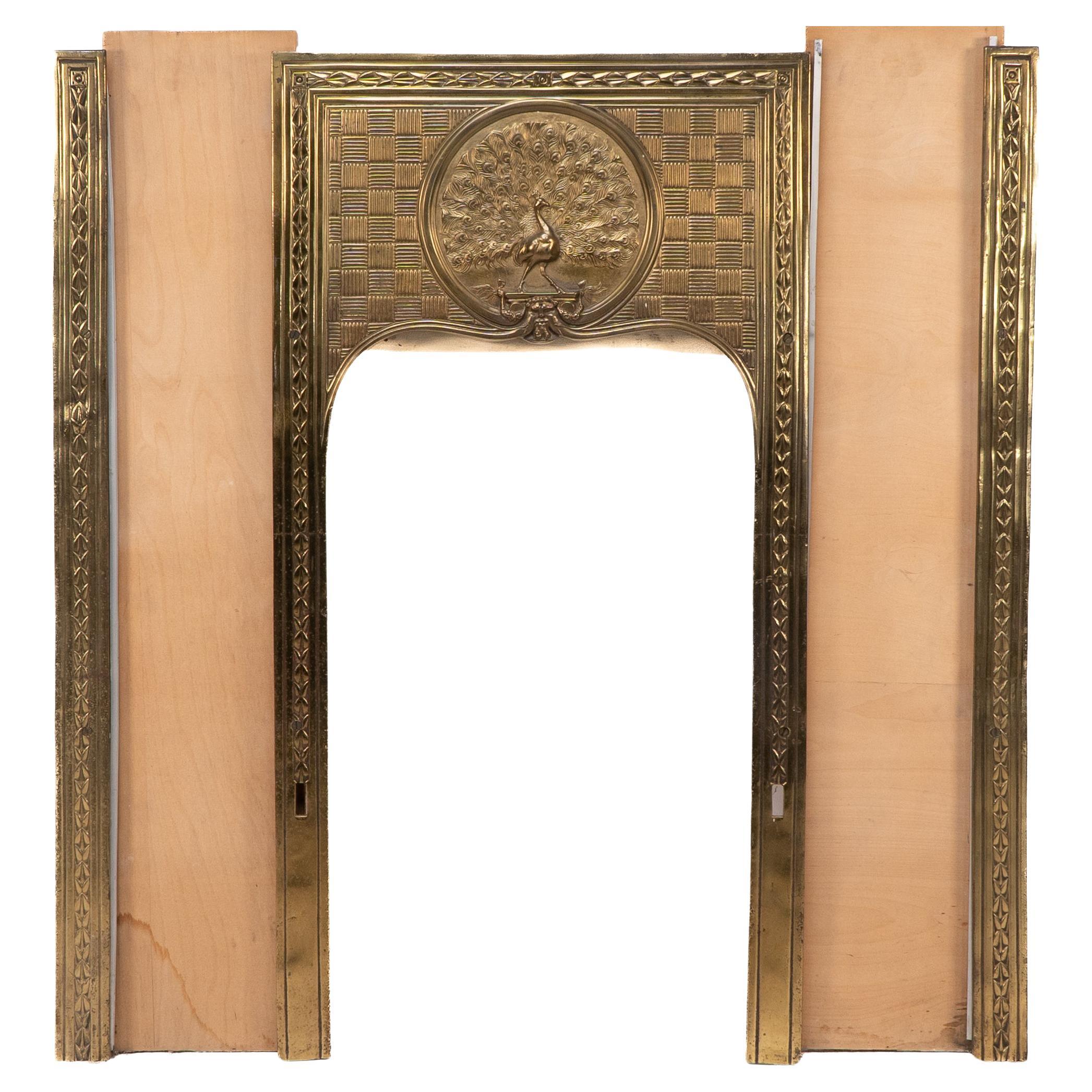 T. Elsley attri. Aesthetic Movement brass fire insert w. upper central peacock For Sale