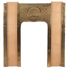 T. Elsley attri. Aesthetic Movement brass fire insert w. upper central peacock