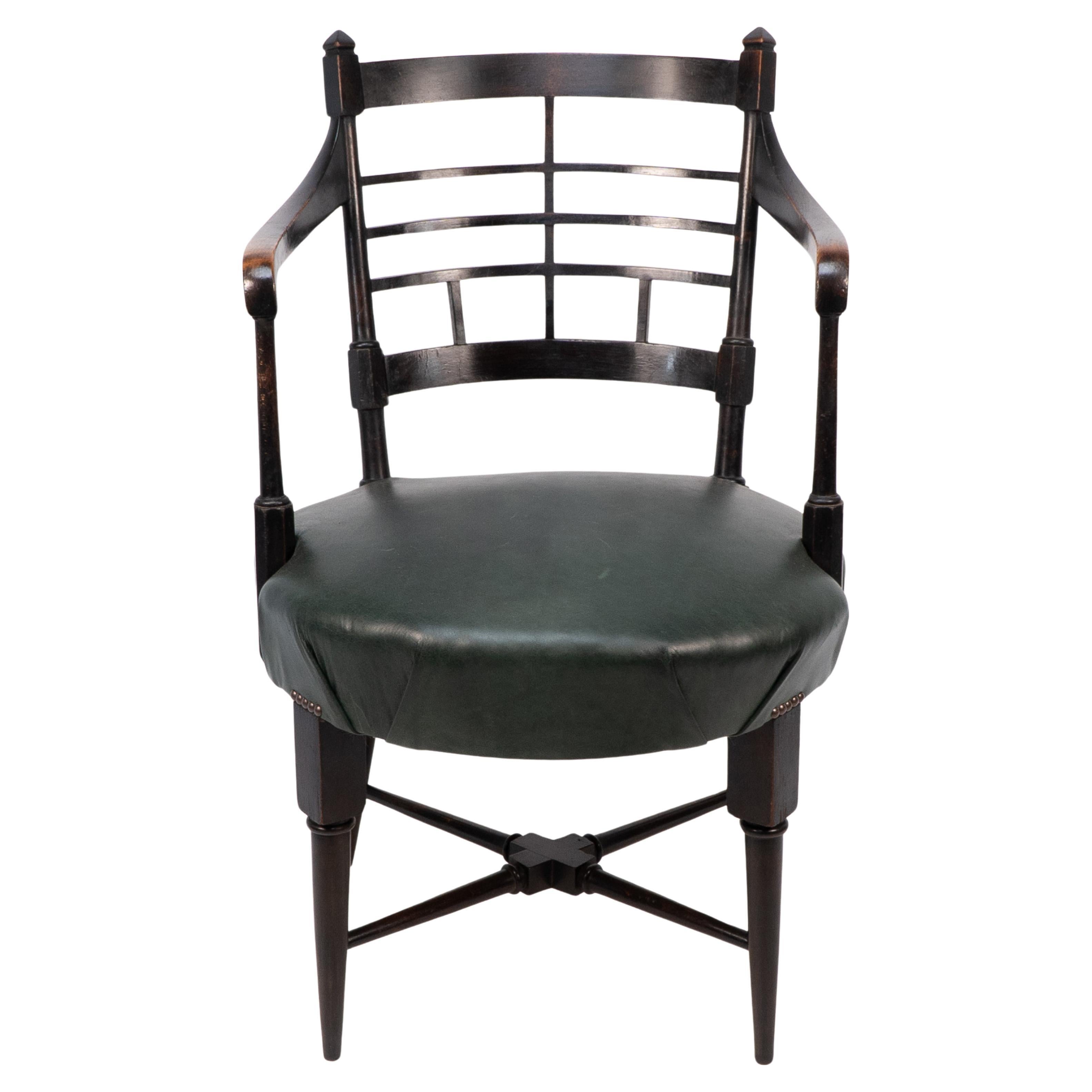 E W Godwin for William Watt. An Anglo-Japanese Old English or Jacobean ebonized armchair. See Susan Webber Soros. The Secular Furniture of E W Godwin Illustration 109 for a cane-seat version.Seat Height: 47 cm Arm Height: 72 cm
