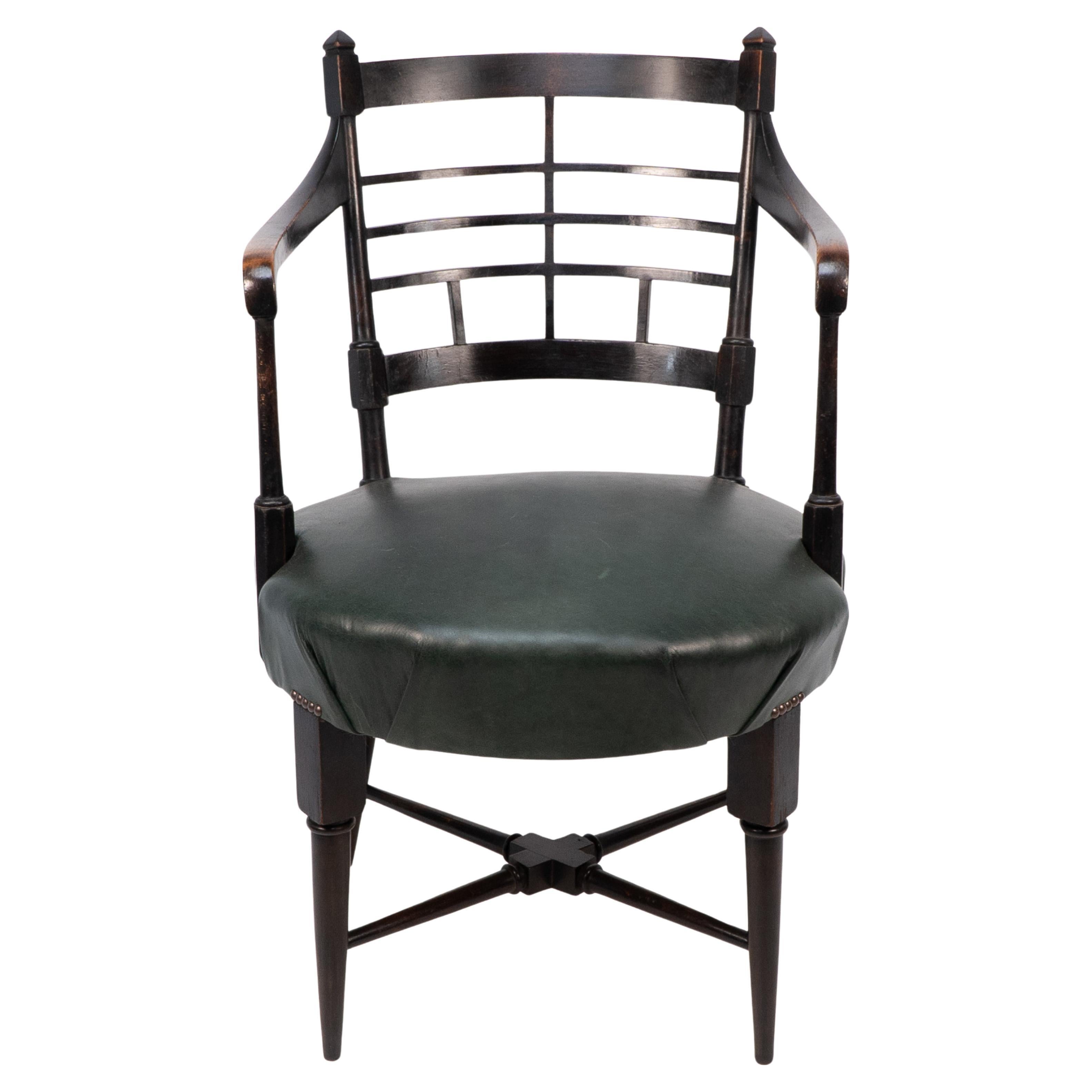 E W Godwin per William Watts. Una poltrona anglo-giapponese in stile antico o giacobino ebanizzato. See One Webber Soros. The Secular Furniture of E W Godwin Illustrazione 109 per una versione con sedile a canna.Altezza della seduta: 47 cm Altezza