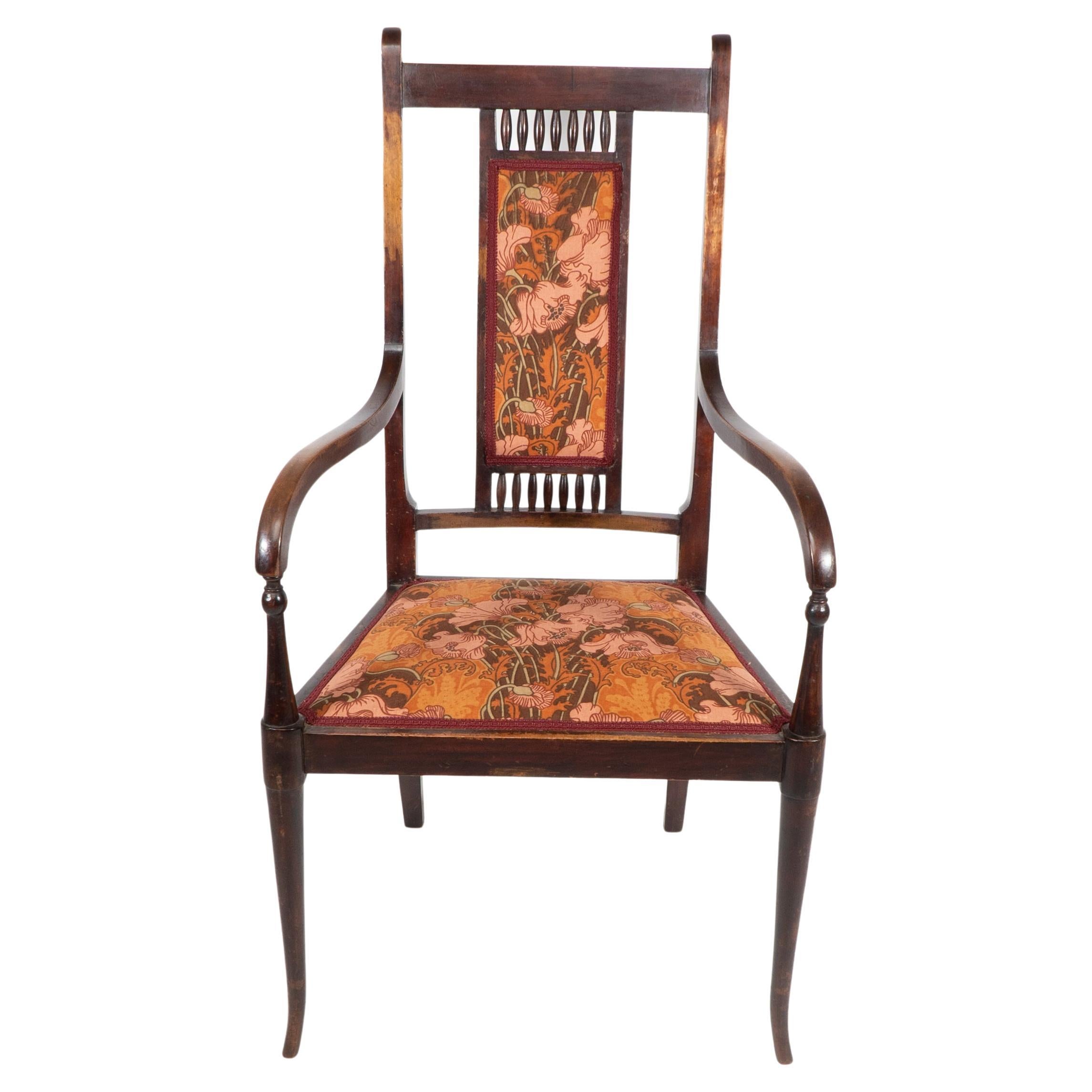 George Walton for John Rowntree's cafe & Miss Cranston tearooms.An Arts and Crafts walnut armchair. George Walton first designed this armchair which had a cane seat and back, around 1896, the year he began designing the interiors of fashionable tea