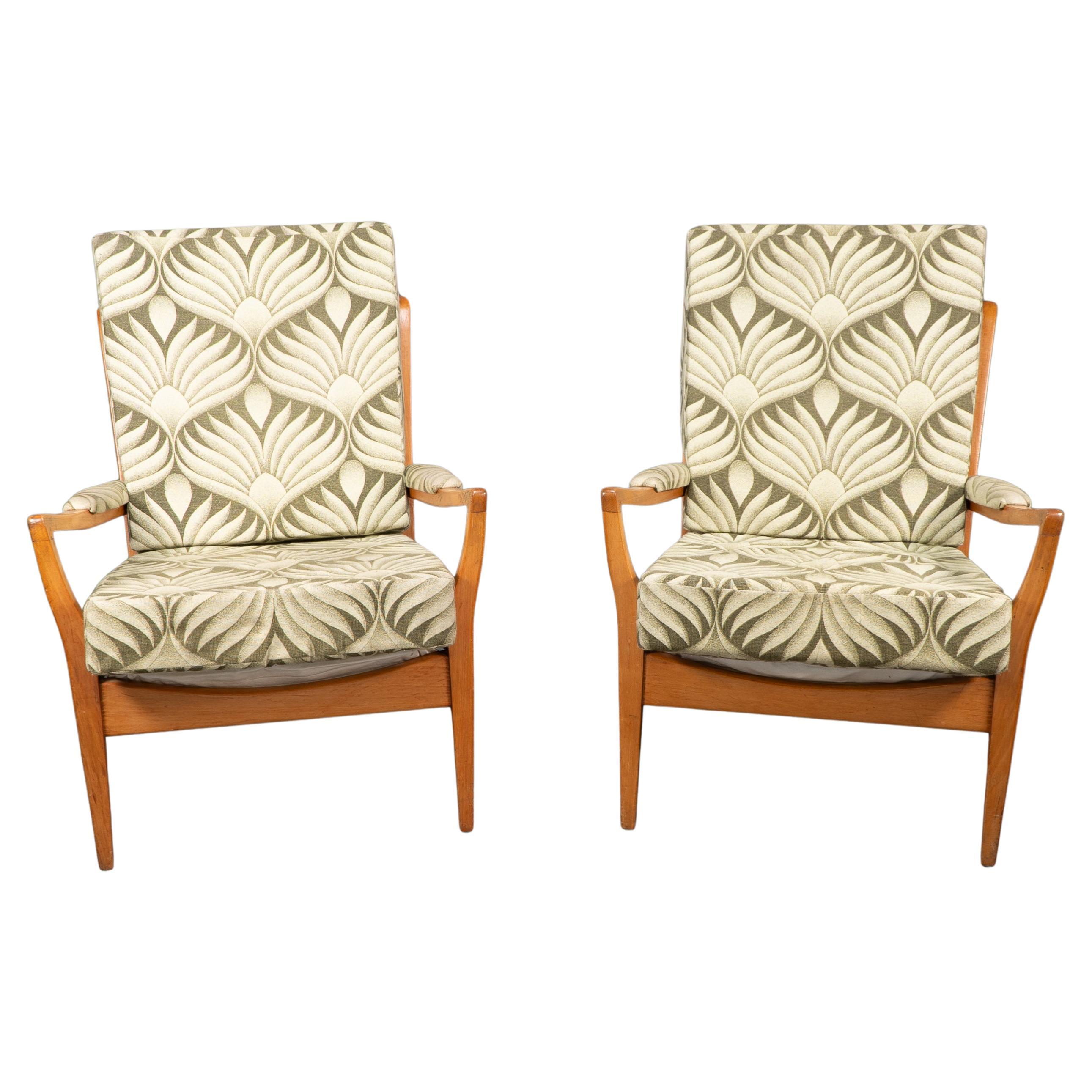 A pair of Mid-Century beech armchairs with outswept upholstered arms recently professionally reupholstered.Seat Height: 44 cm Arm Height: 55 cm
