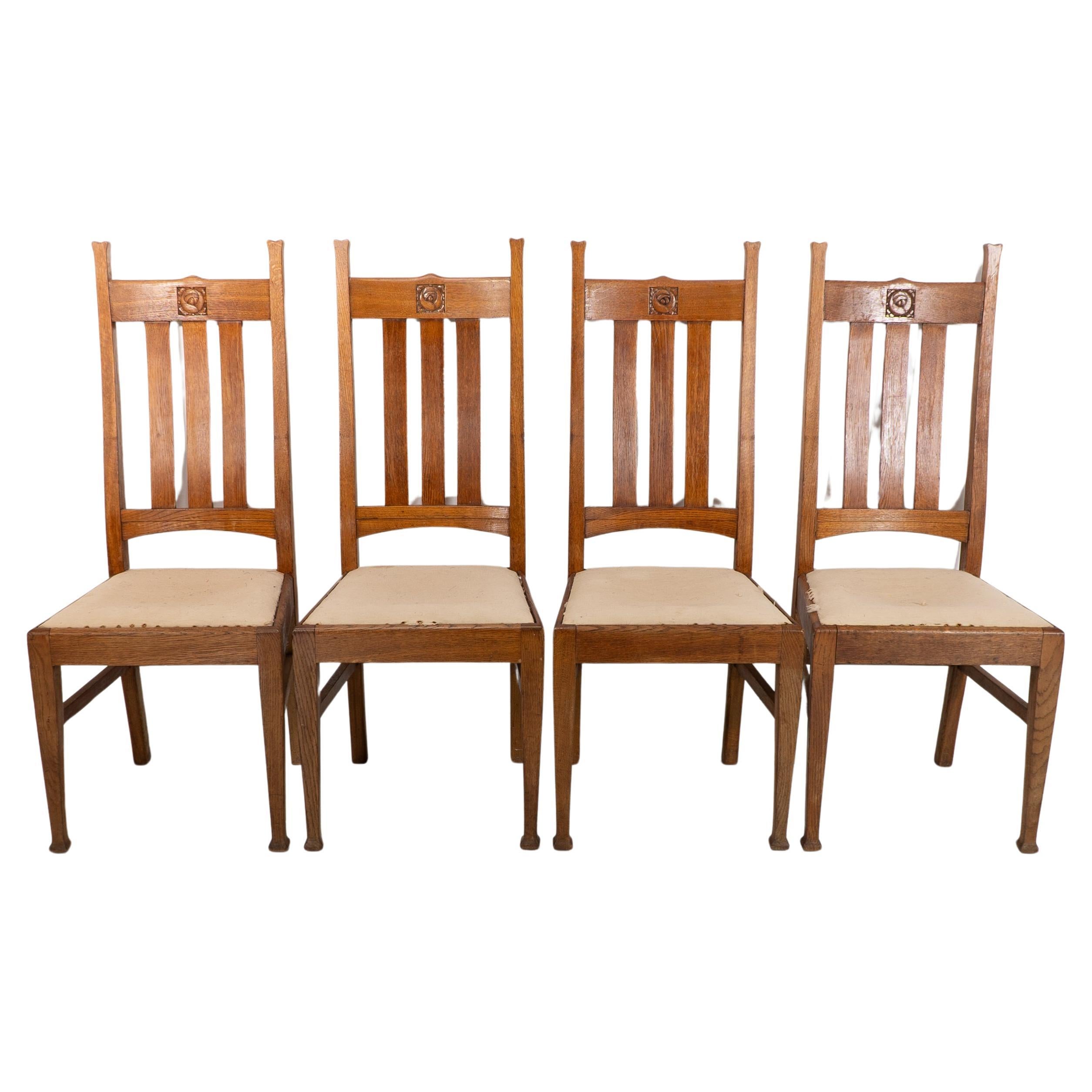 E A Taylor for Wylie & Lochhead. A set of four Arts and Crafts oak dining chairs For Sale