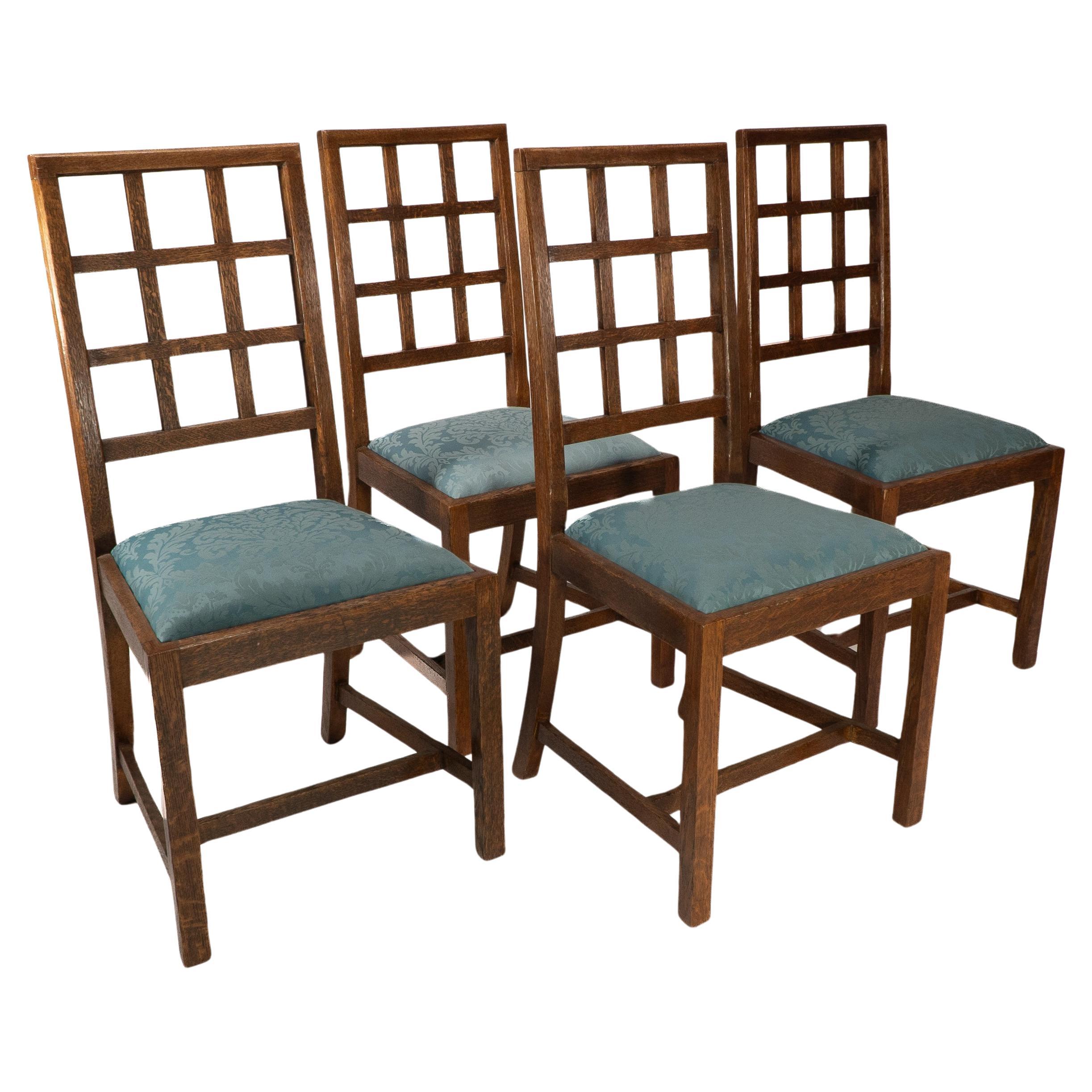 Heals. Set of 4 Arts & Crafts oak lattice back dining chairs & blue Damask seats For Sale