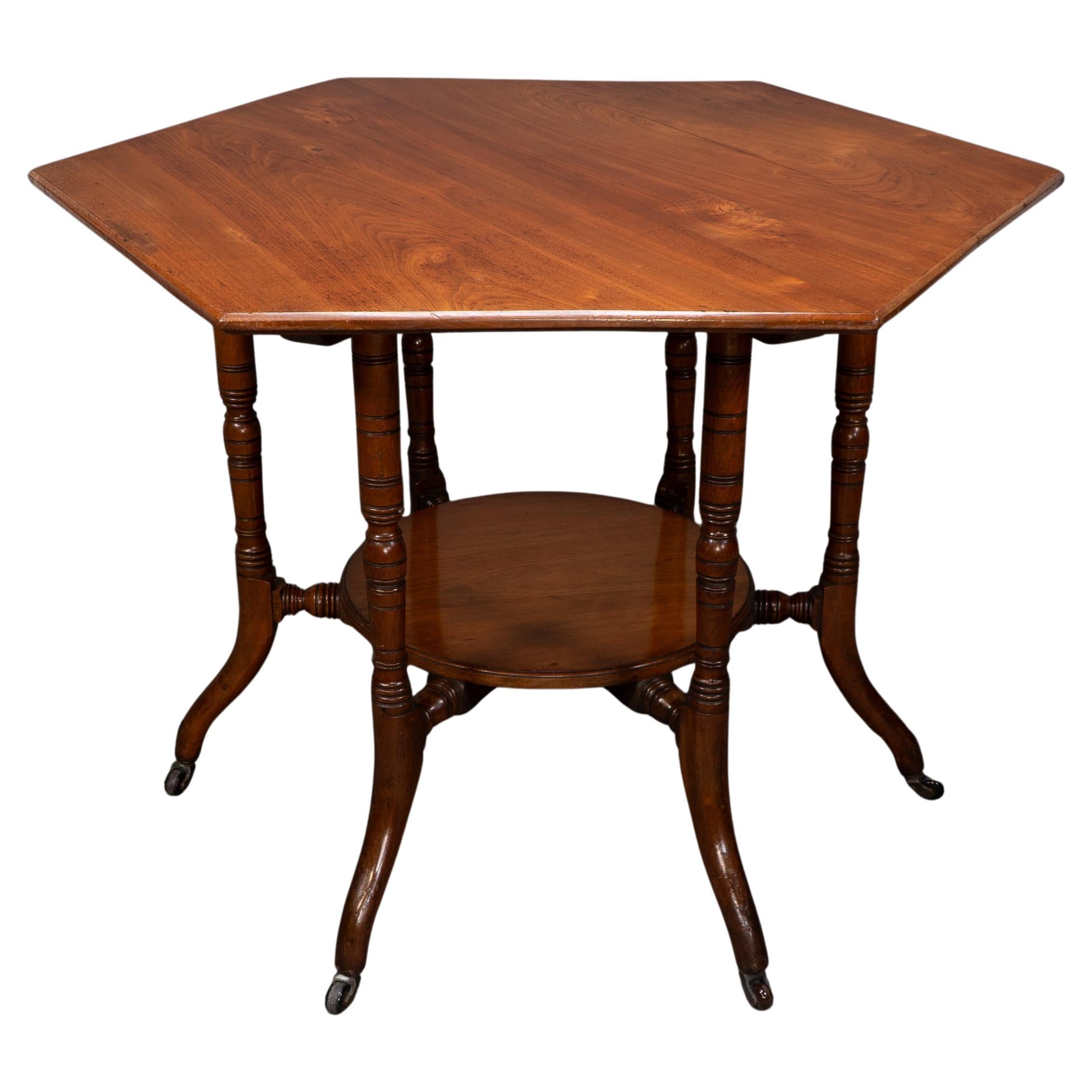 Collinson & Lock attributed. An Aesthetic Movement walnut octagonal center table For Sale