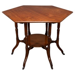 Collinson & Lock attributed. An Aesthetic Movement walnut octagonal center table