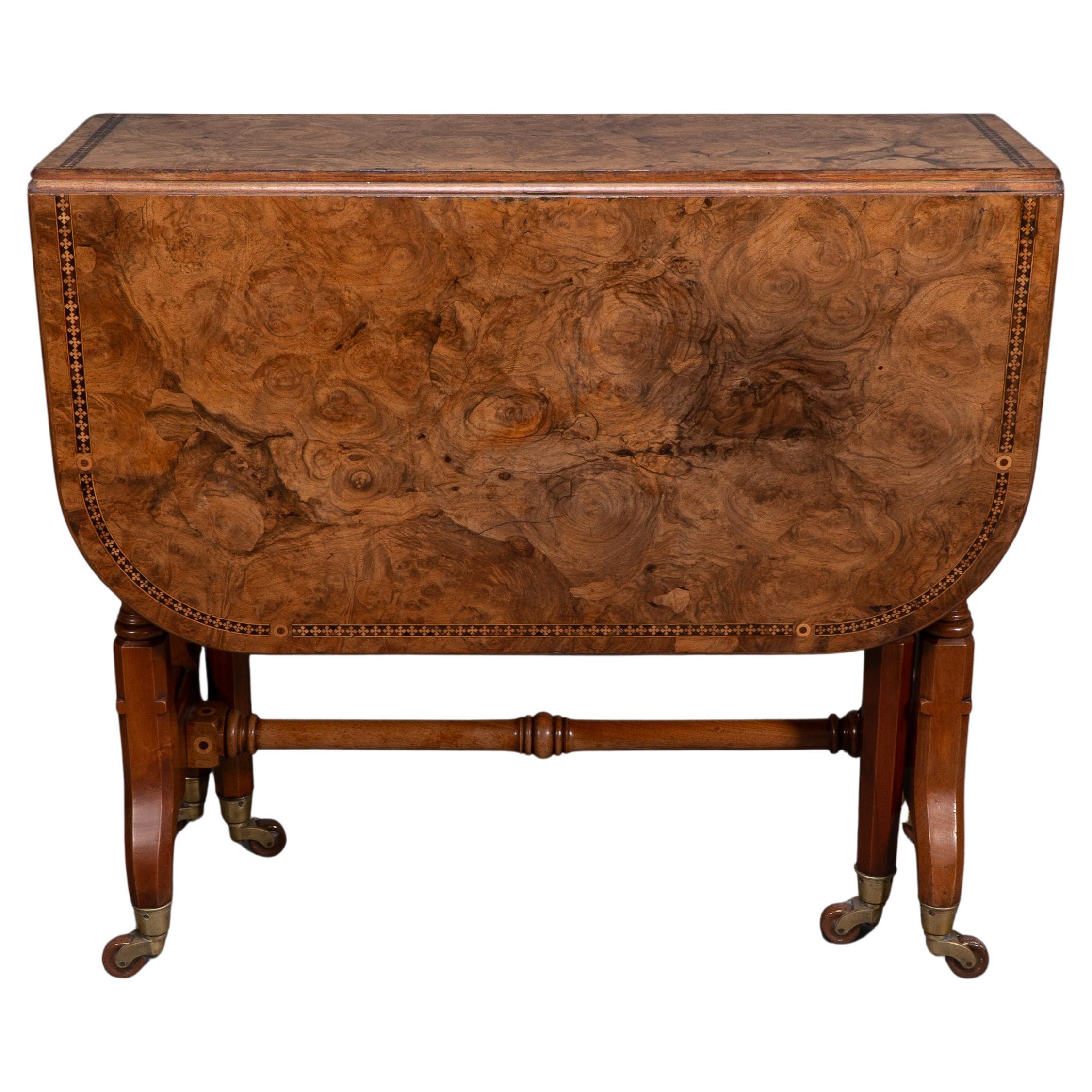 Charles Bevan for Marsh & Jones Late Kendal. An exhibition quality Gothic Revival Burr Walnut drop leaf Sutherland table with fine inlaid decoration to the top in exceptional original condition. Retaining the original Marsh & Jones paper