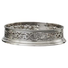 Set of four early-George-III pierced antique sterling silver wine coasters