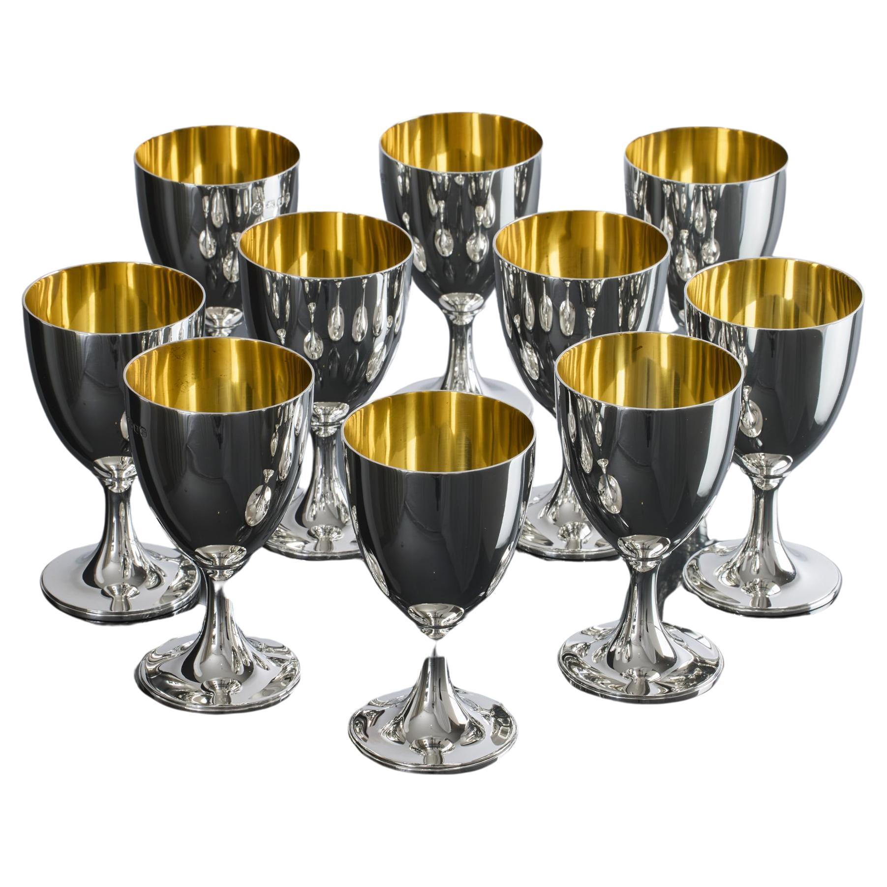 Set of eight gilt-lined silver wine goblets