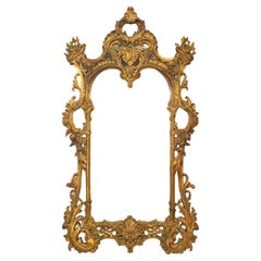 Miroir mural anglais de style Chippendale en bois doré sculpté