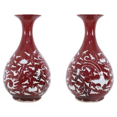 Pair of Chinese Burgundy and White Botanical Motif Porcelain Vases